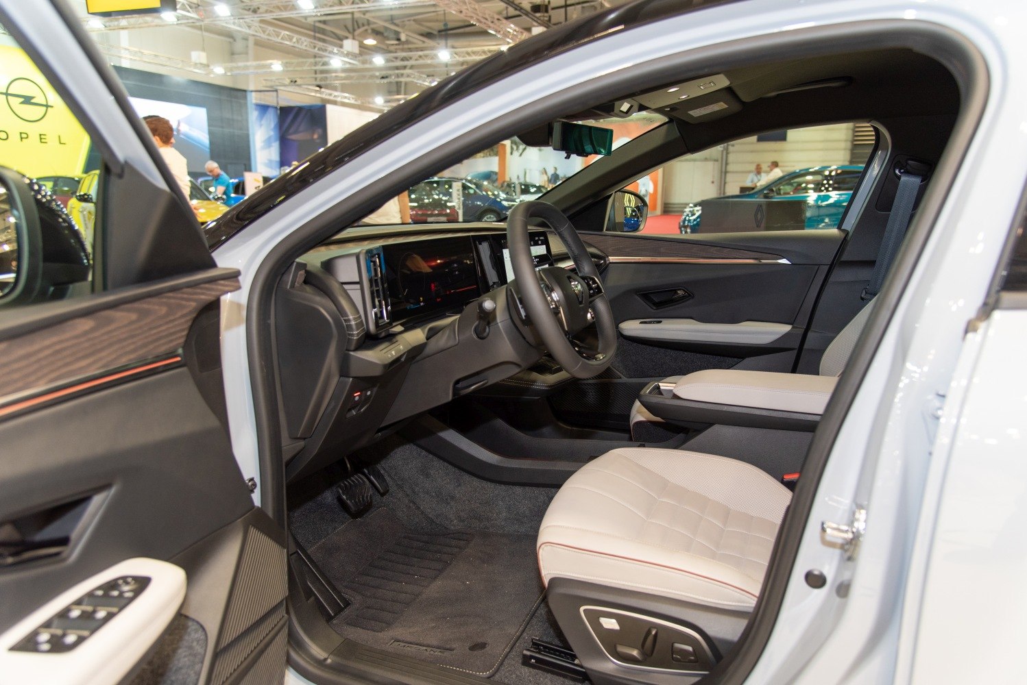 Modern electric vehicle interior with digital dashboard and premium seats