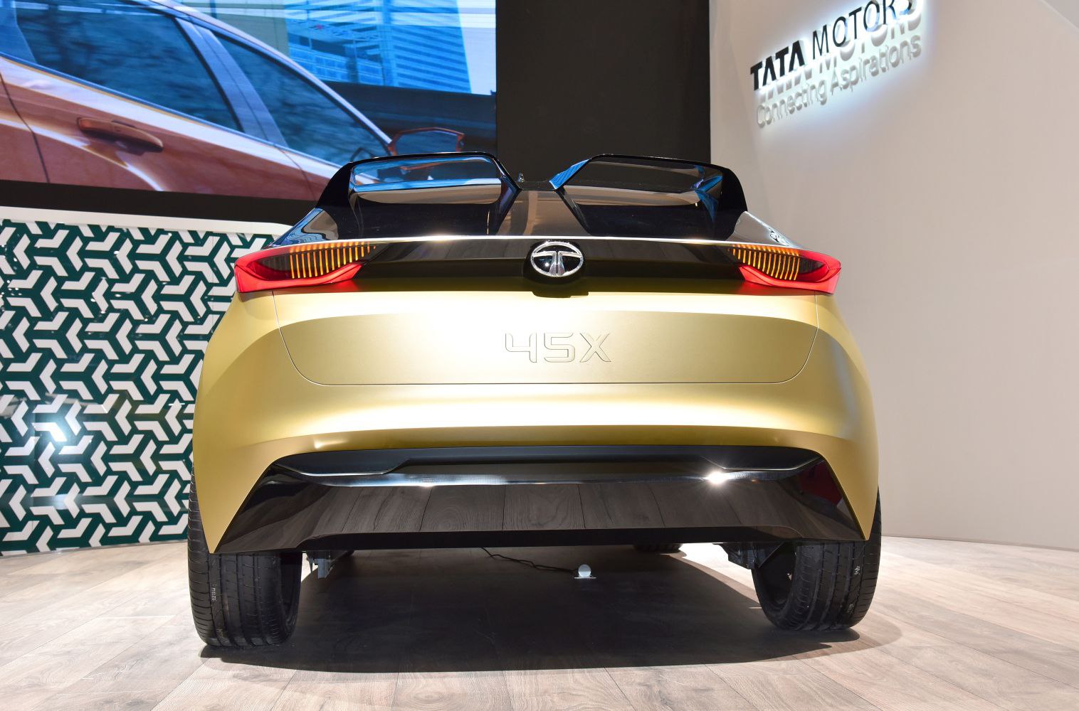 Car rear view with sleek tail lights and integrated badge