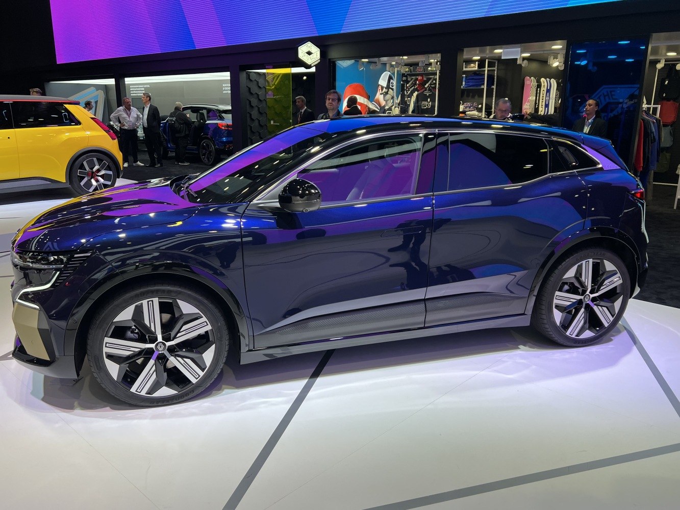 Aerodynamic side profile showcasing alloy wheels and sleek door design