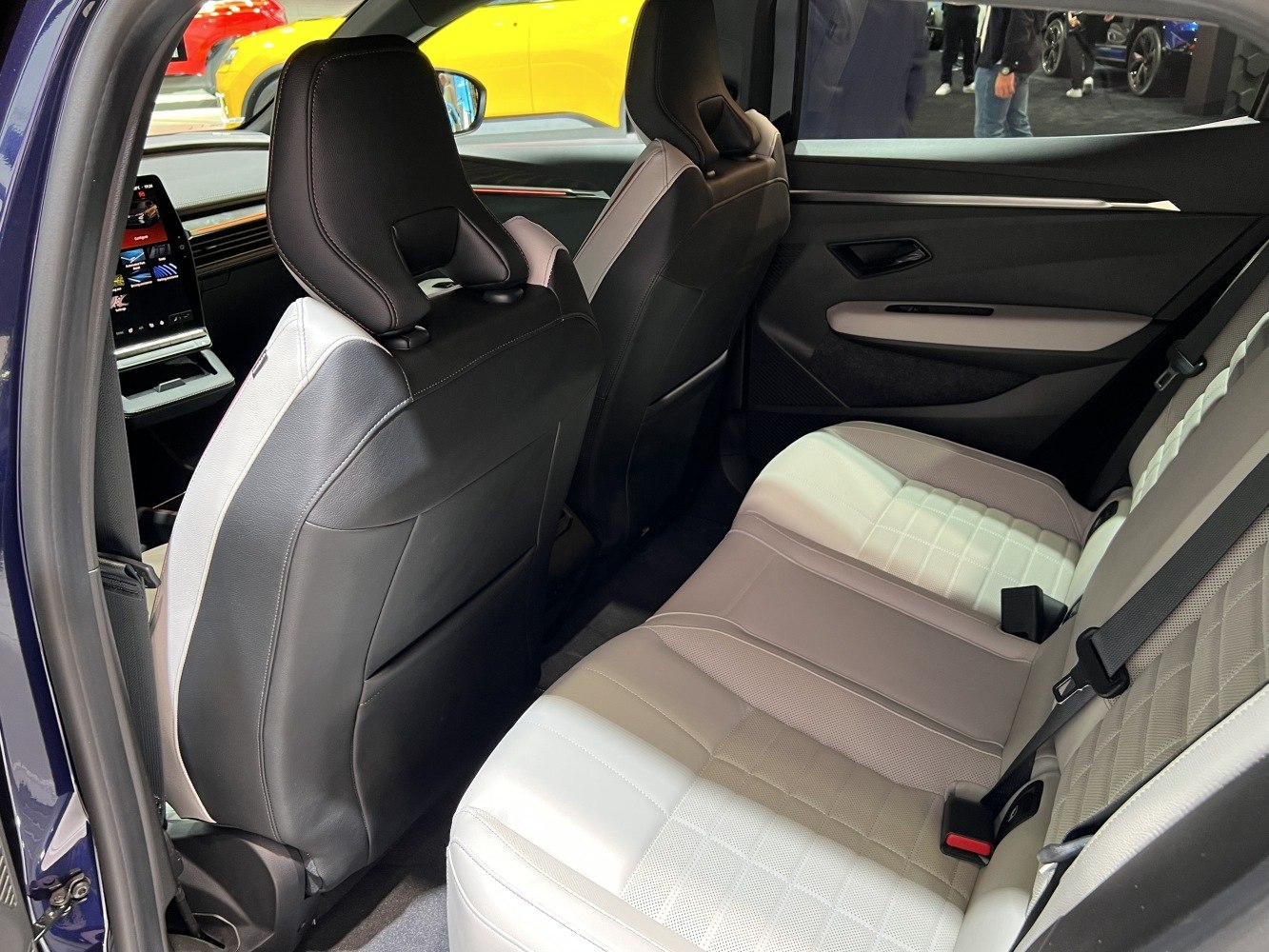 Rear seat interior with black and white upholstery and spacious seating