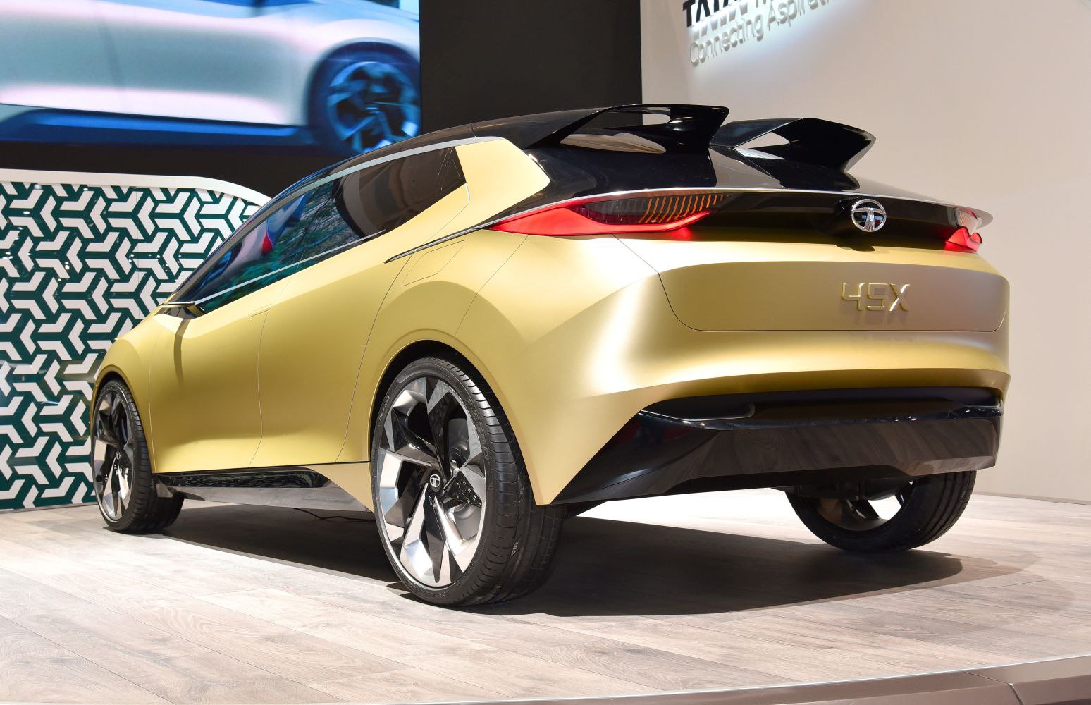 Futuristic rear design with sharp tail lights and large alloy wheels