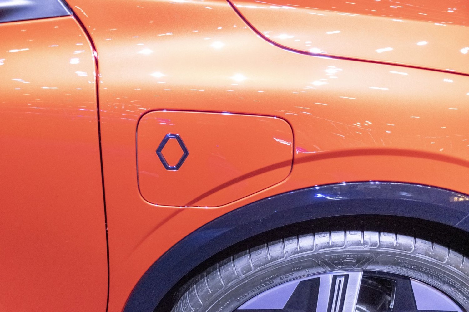 Electric vehicle charging port and wheel close-up
