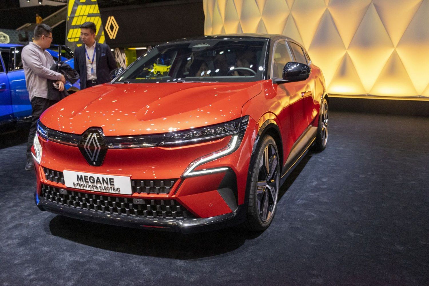 Modern electric car front with distinctive grille and LED headlights