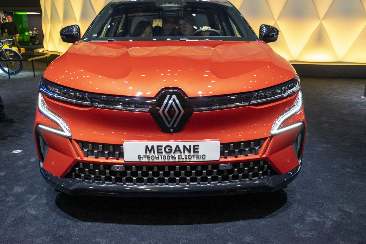 Front view with LED headlights and black grille of electric vehicle