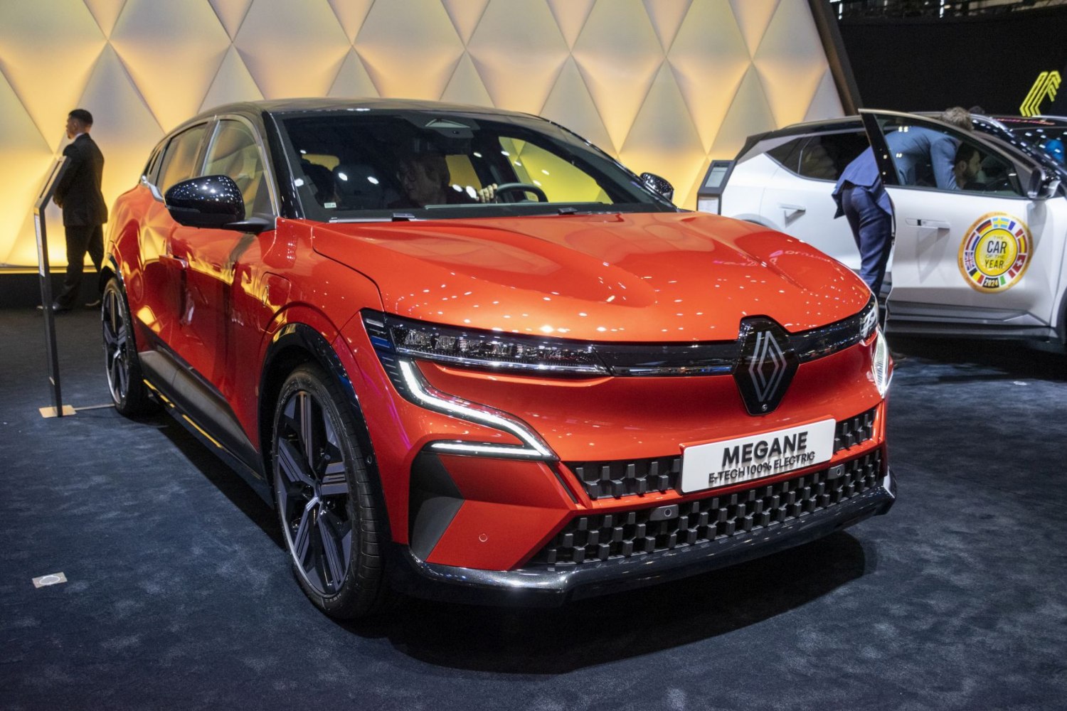 Front view of sleek electric hatchback with LED headlights and sporty wheels