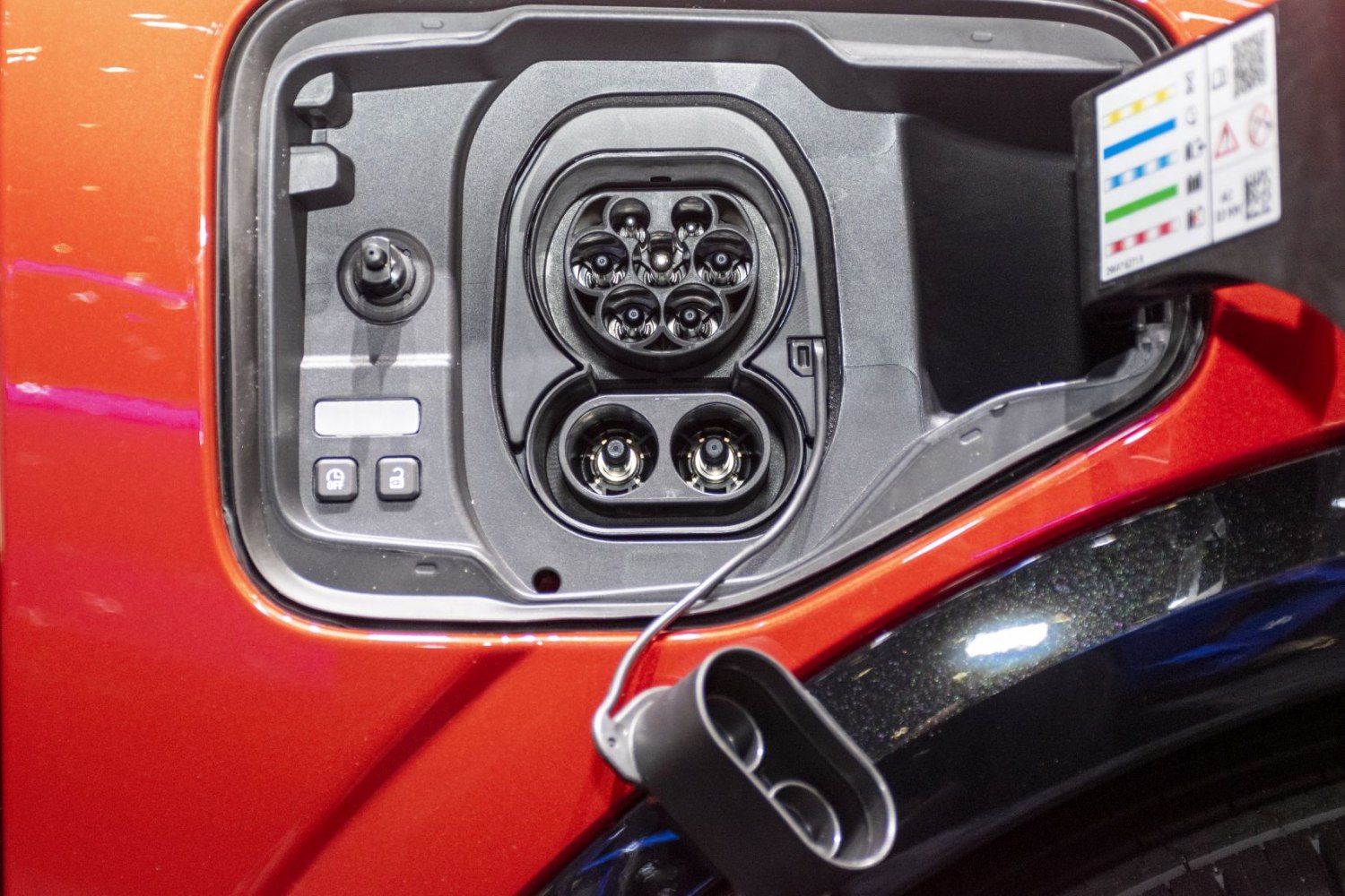 Close-up of electric vehicle charging port and connector