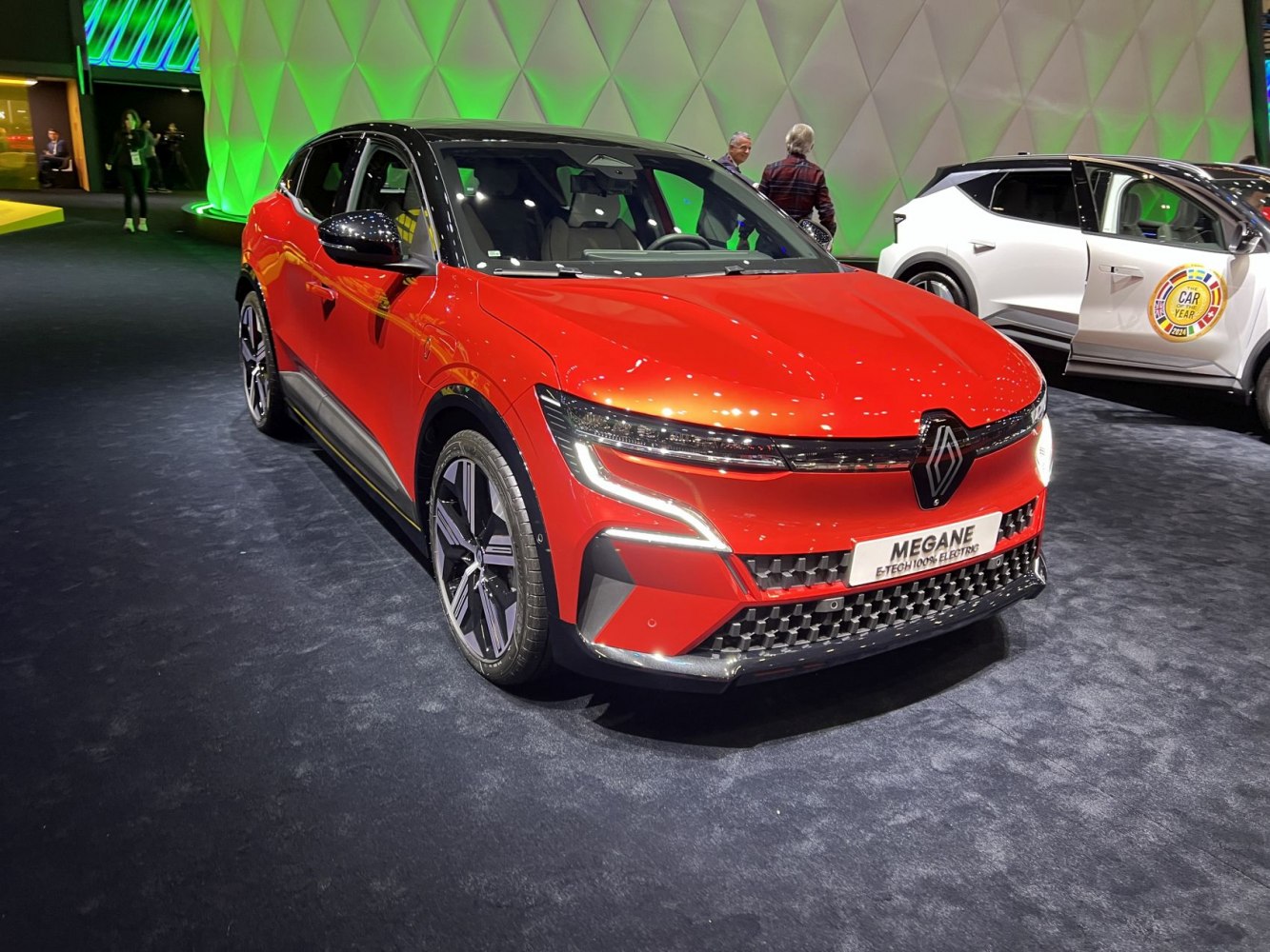Front view of electric compact hatchback with LED headlights and aerodynamic styling