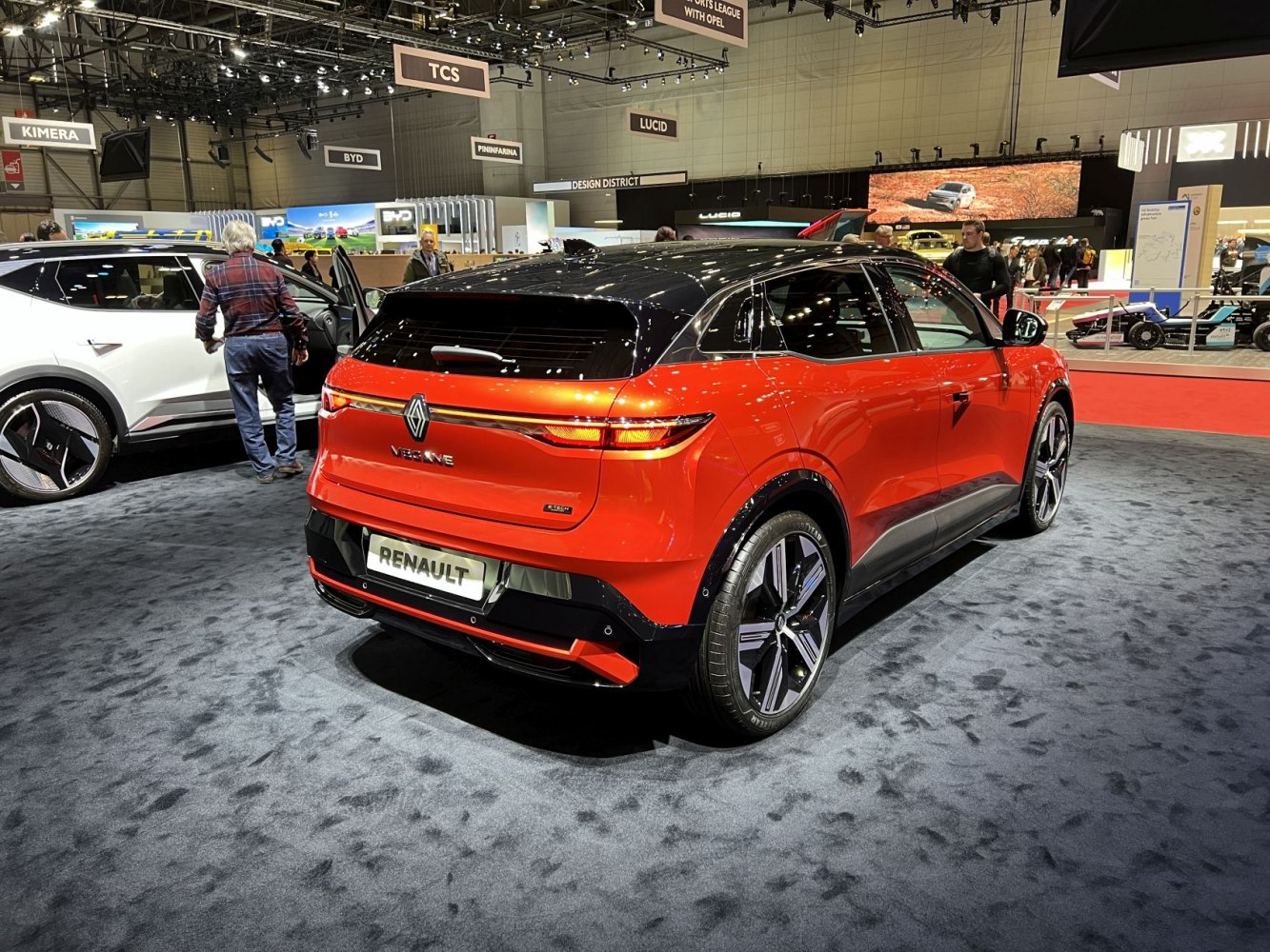 Rear view of a two-tone electric hatchback with sleek LED light bar.