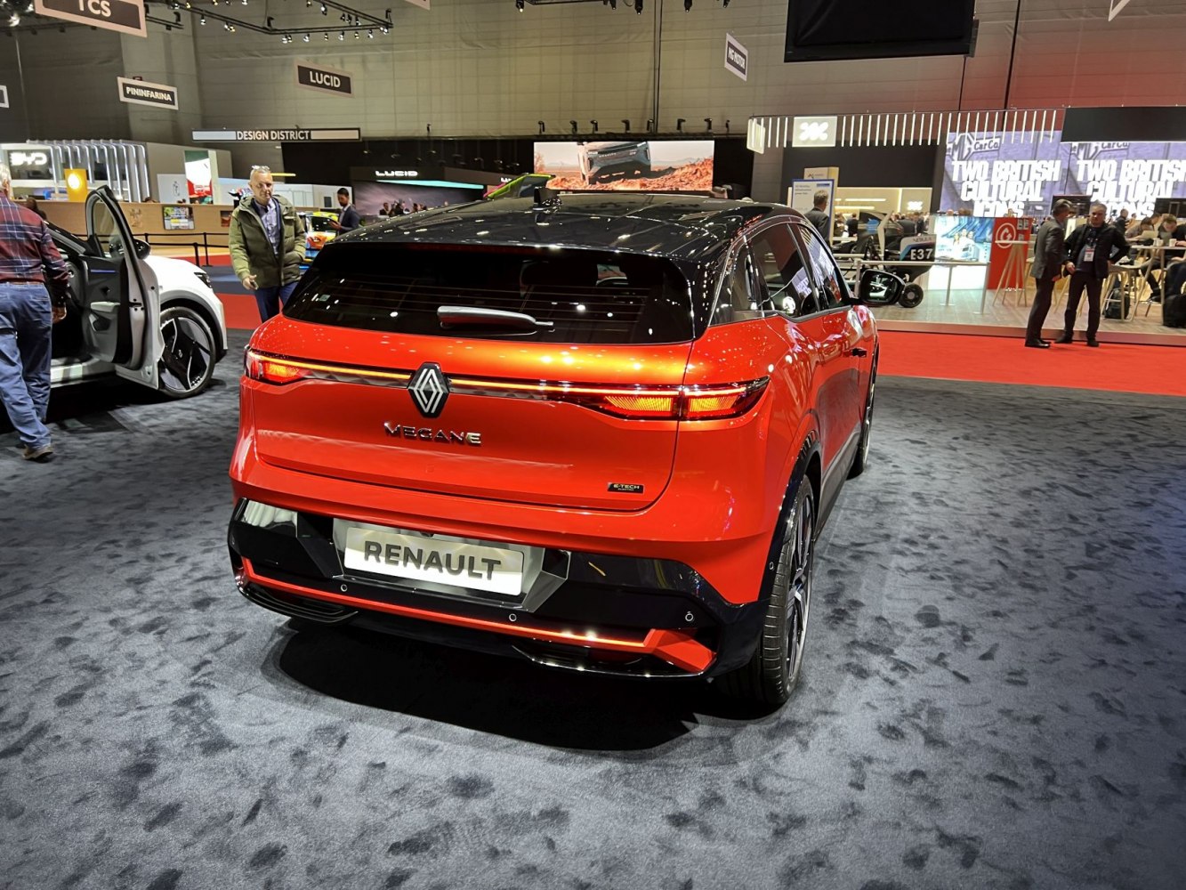 Sleek rear view of electric hatchback with continuous tail light.