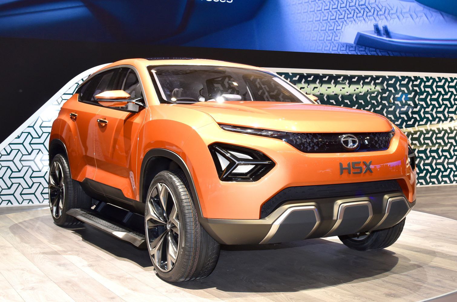 Orange SUV with angular LED headlights and large alloy wheels