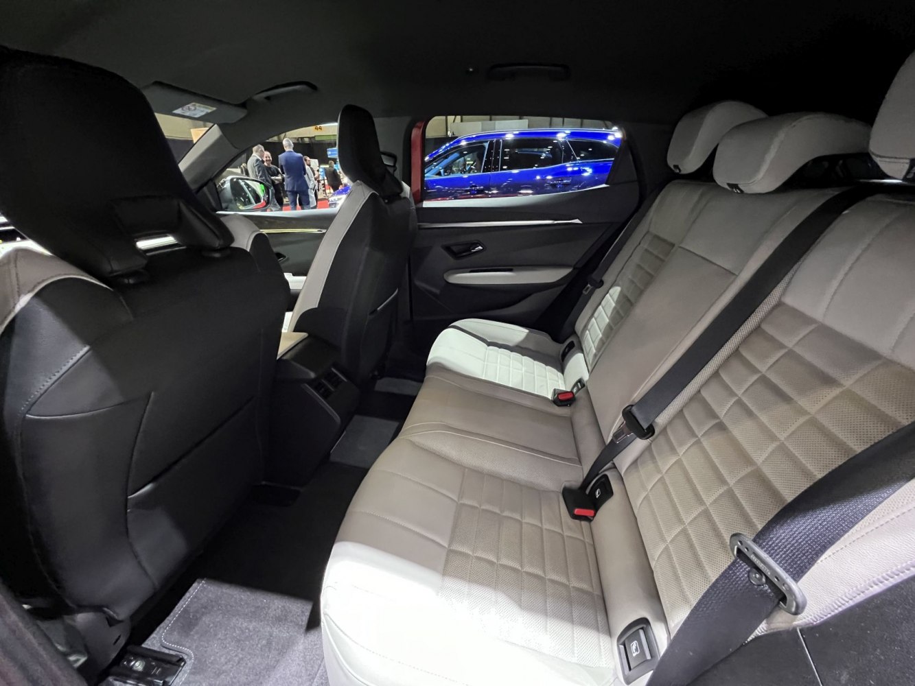 Spacious rear leather seats with quilted pattern and integrated headrests.