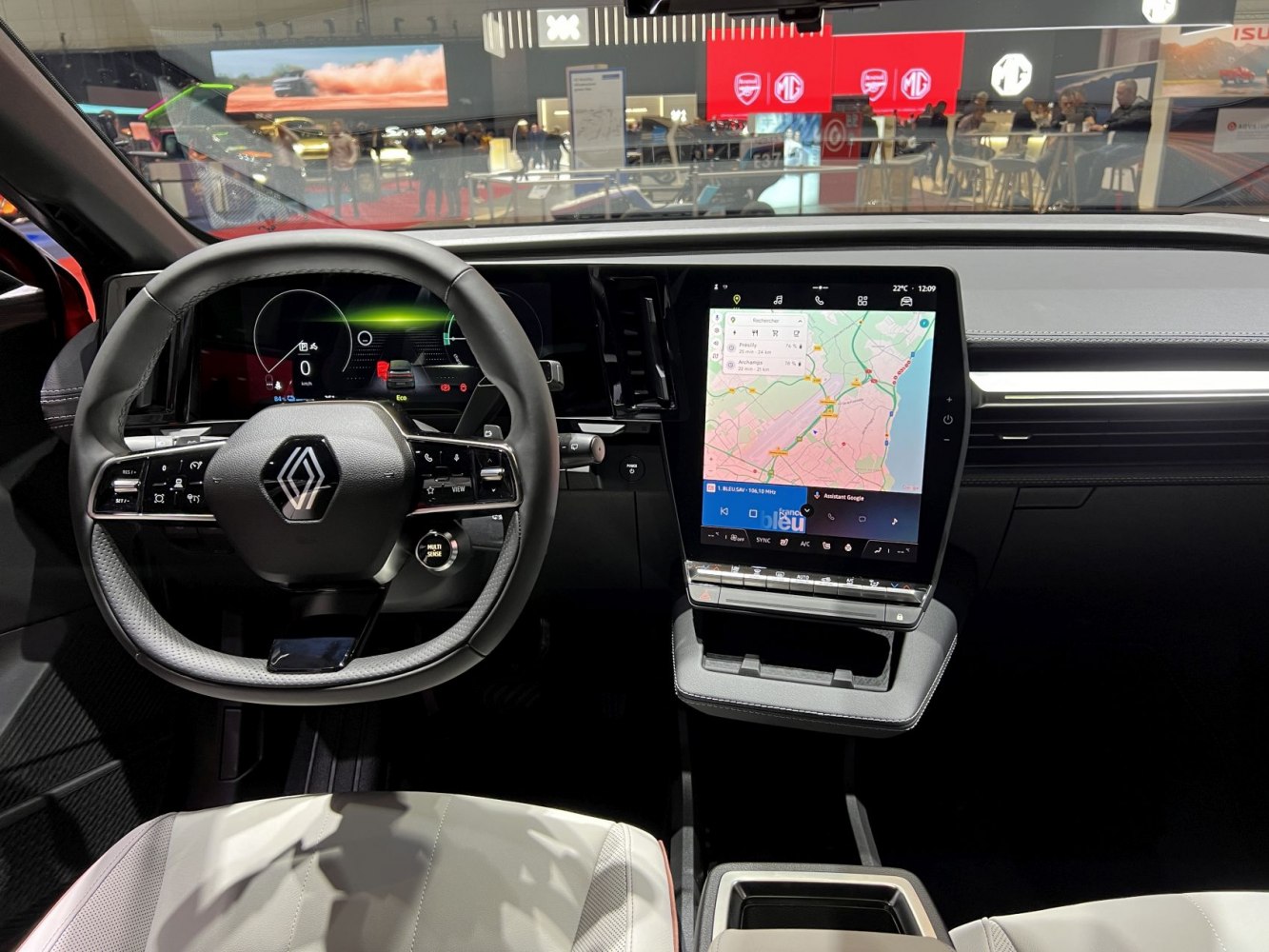 Steering wheel with multifunction controls and large vertical touchscreen with map display