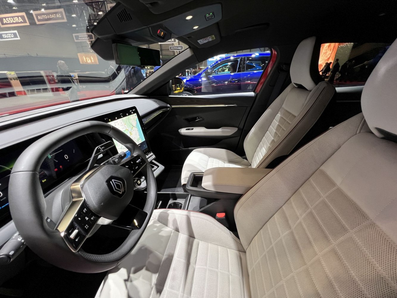 Modern interior with digital dashboard and quilted beige seats