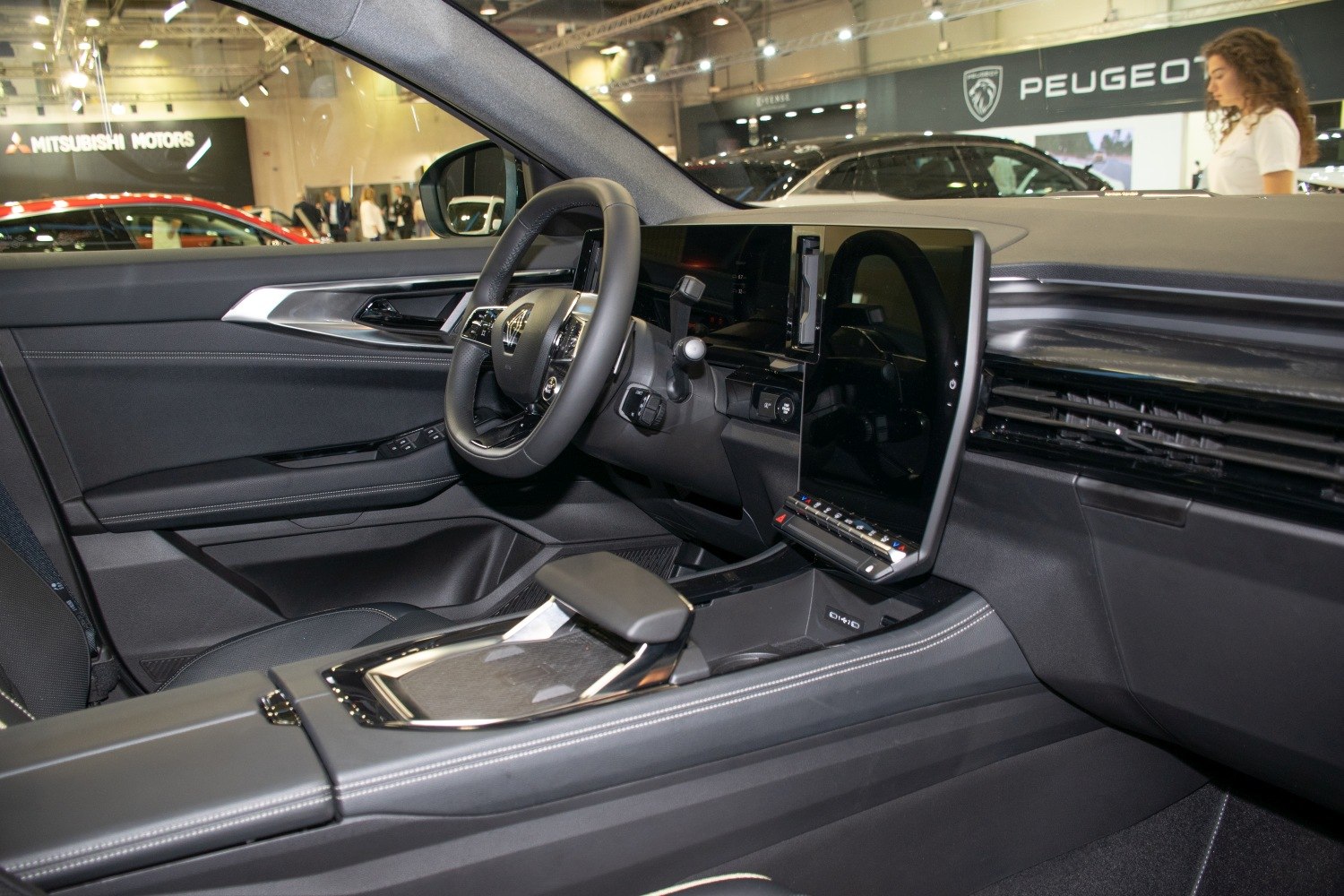 Digital dashboard and touchscreen infotainment system with steering wheel controls