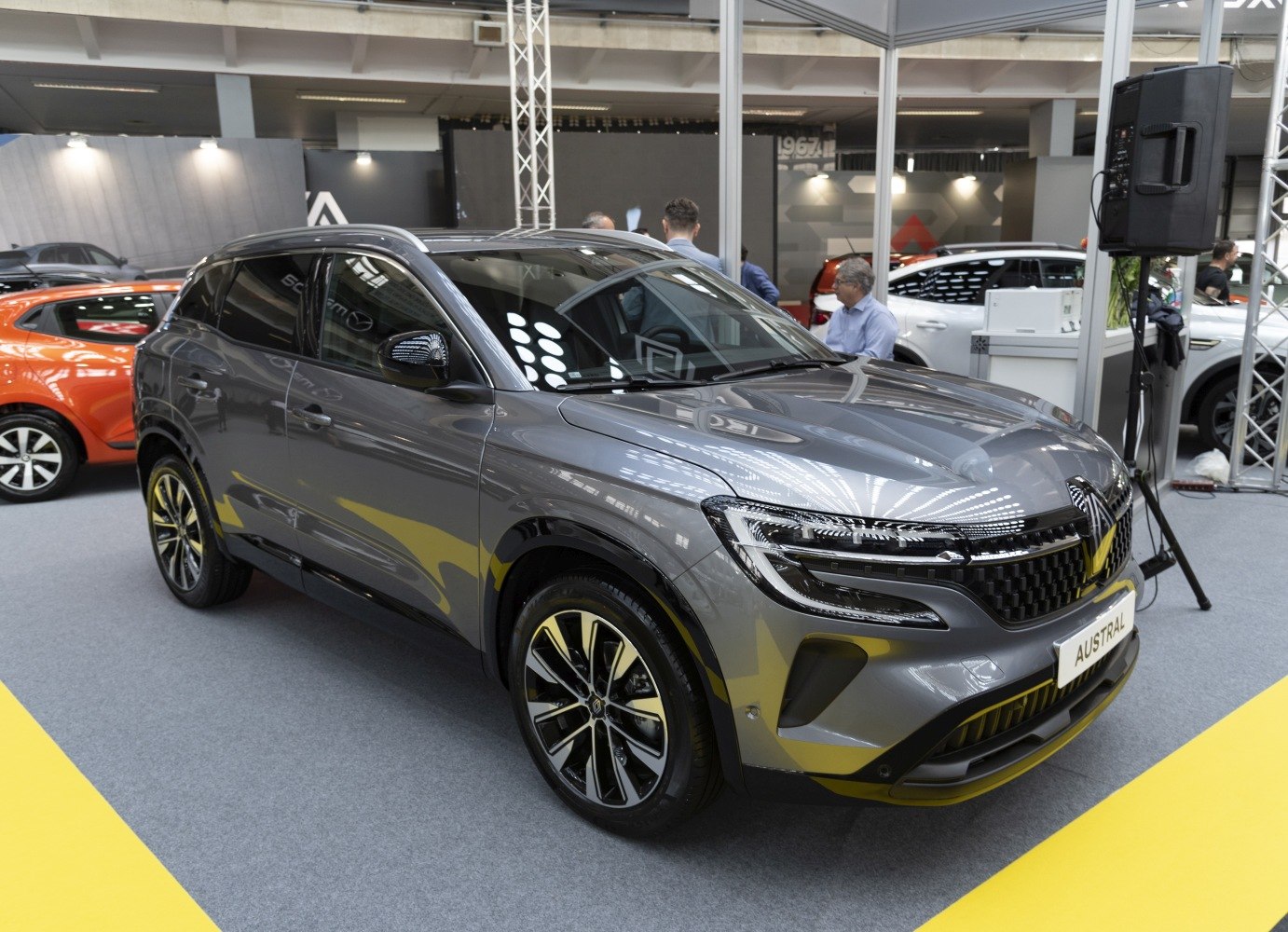 Front side view of a modern grey SUV with stylish alloy wheels.