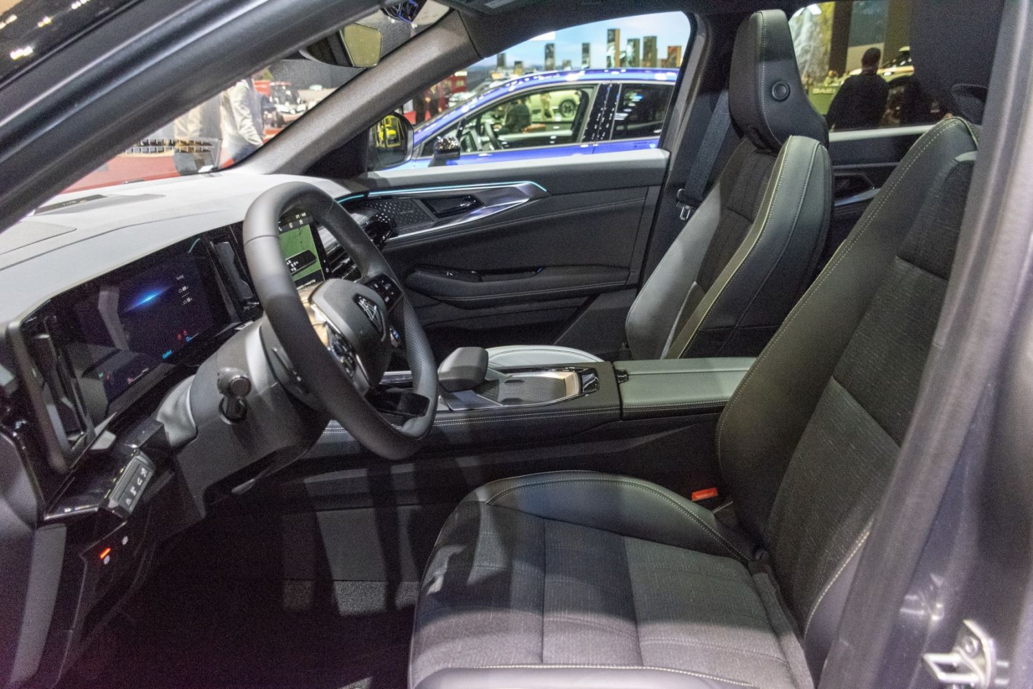 Modern car interior with digital dashboard and ergonomic front seats