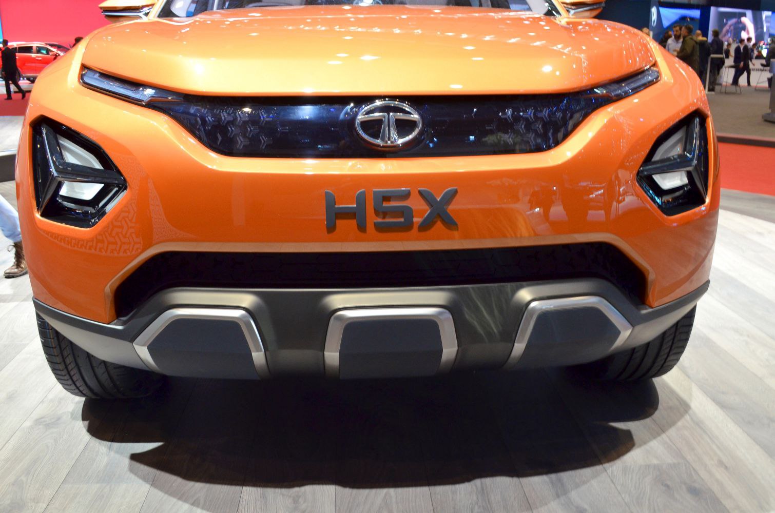 Front grille and futuristic angular headlights of a concept SUV.