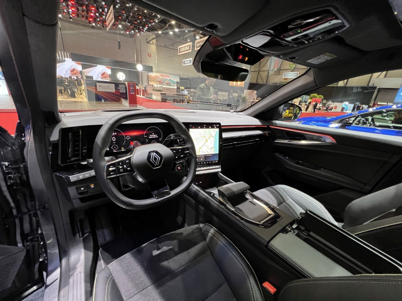 Modern car dashboard with digital instrument cluster and central touchscreen.