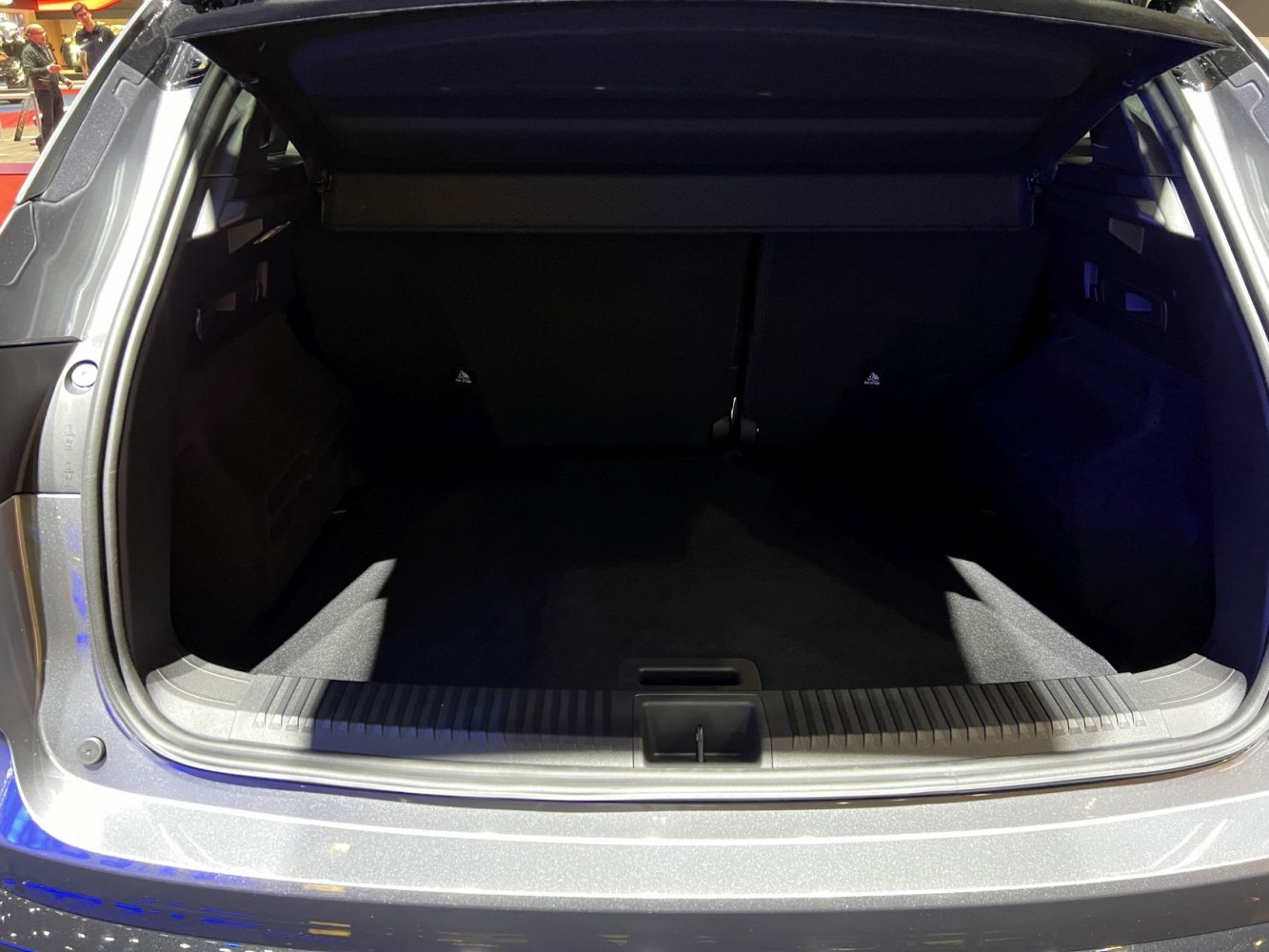 Spacious and well-lit trunk interior with protective lining and neat finish