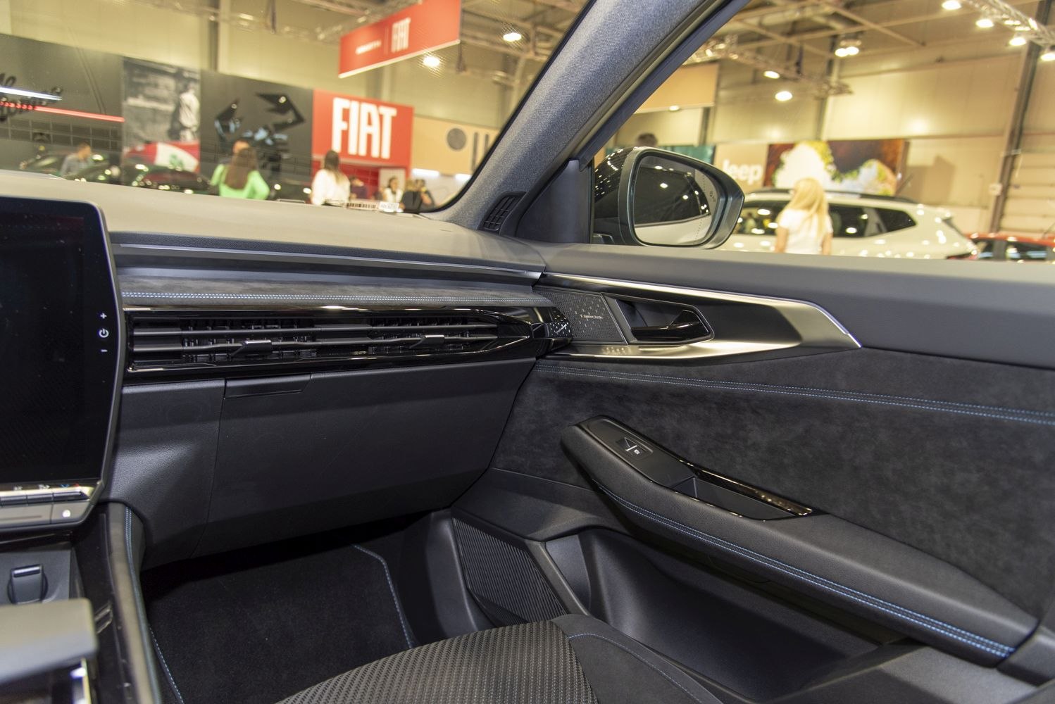 Interior door panel with window control and dashboard air vents