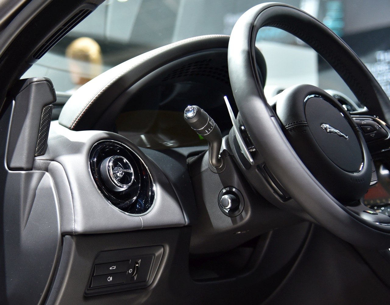 Steering wheel, dashboard, and air vent design in luxury car interior
