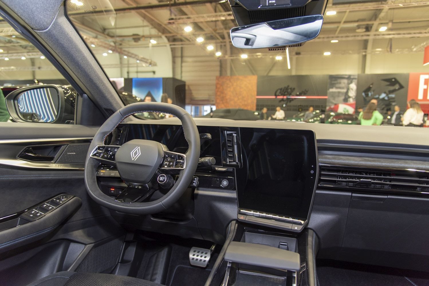 Modern interior with digital dashboard and large vertical touchscreen