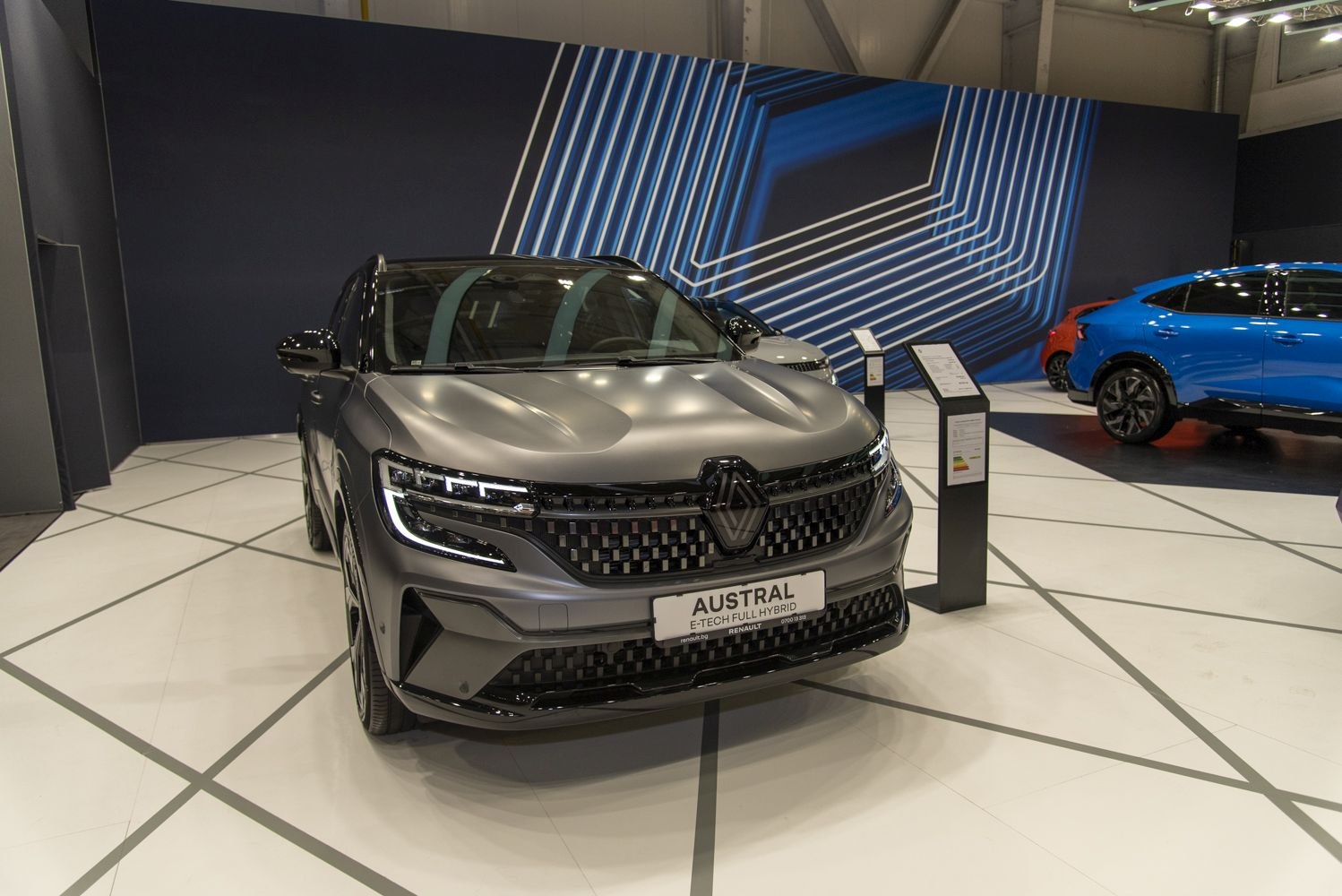 Front view with LED headlights and black patterned grille