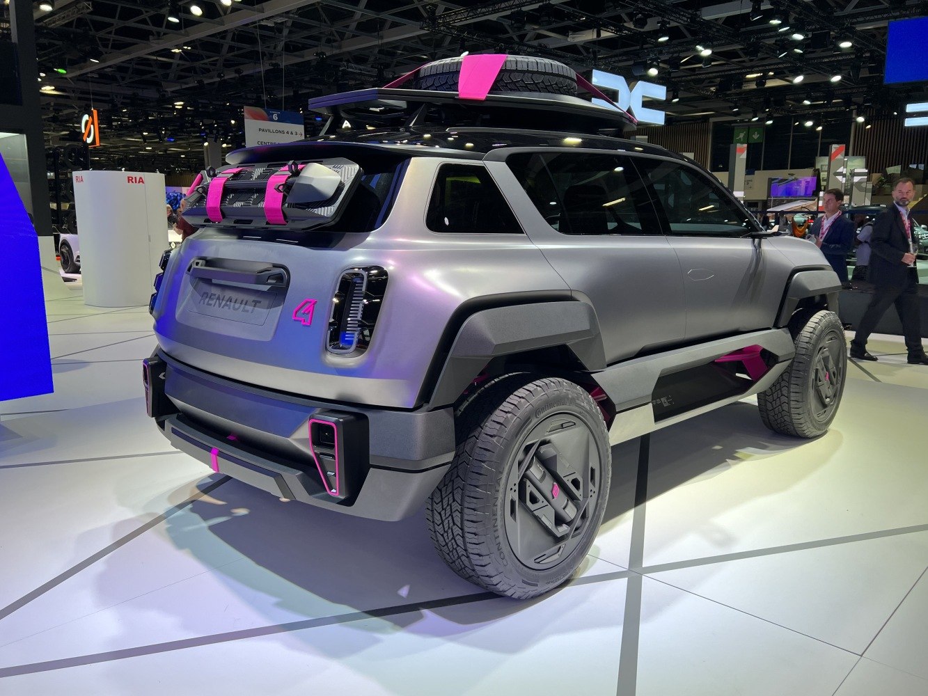 Rear and side view with mounted spare wheel and LED tail lights.