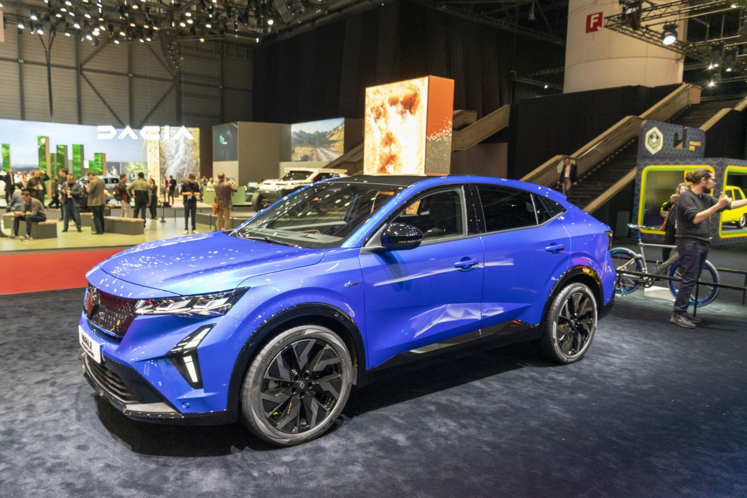 Blue modern crossover with futuristic LED headlights and black alloy wheels