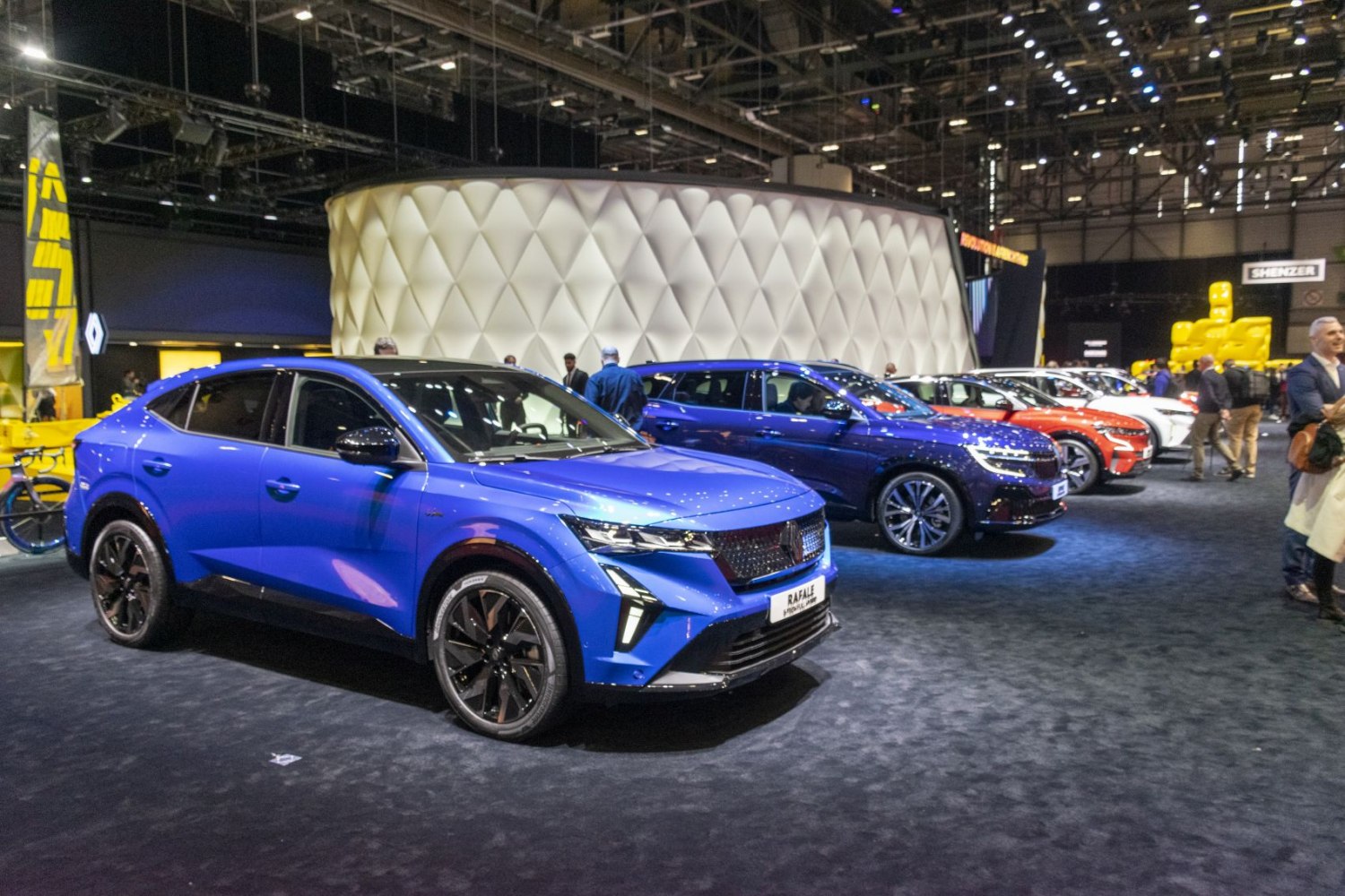 Blue modern electric SUV front view with black alloy wheels