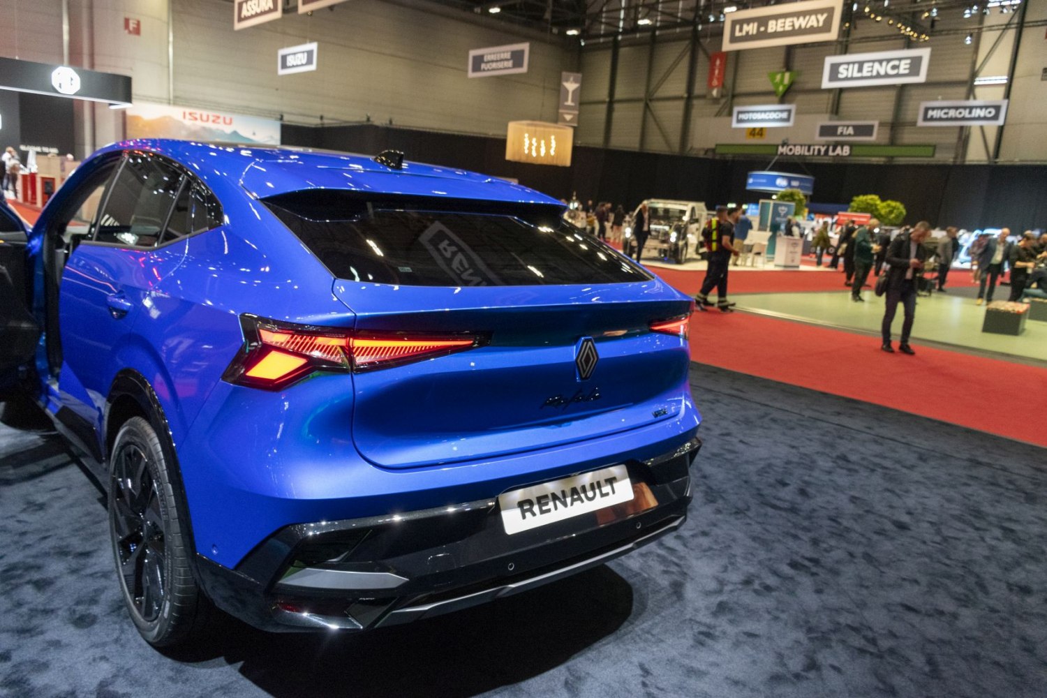 Rear view of a blue SUV coupe with sharp, angular tail lights and a sleek rear design