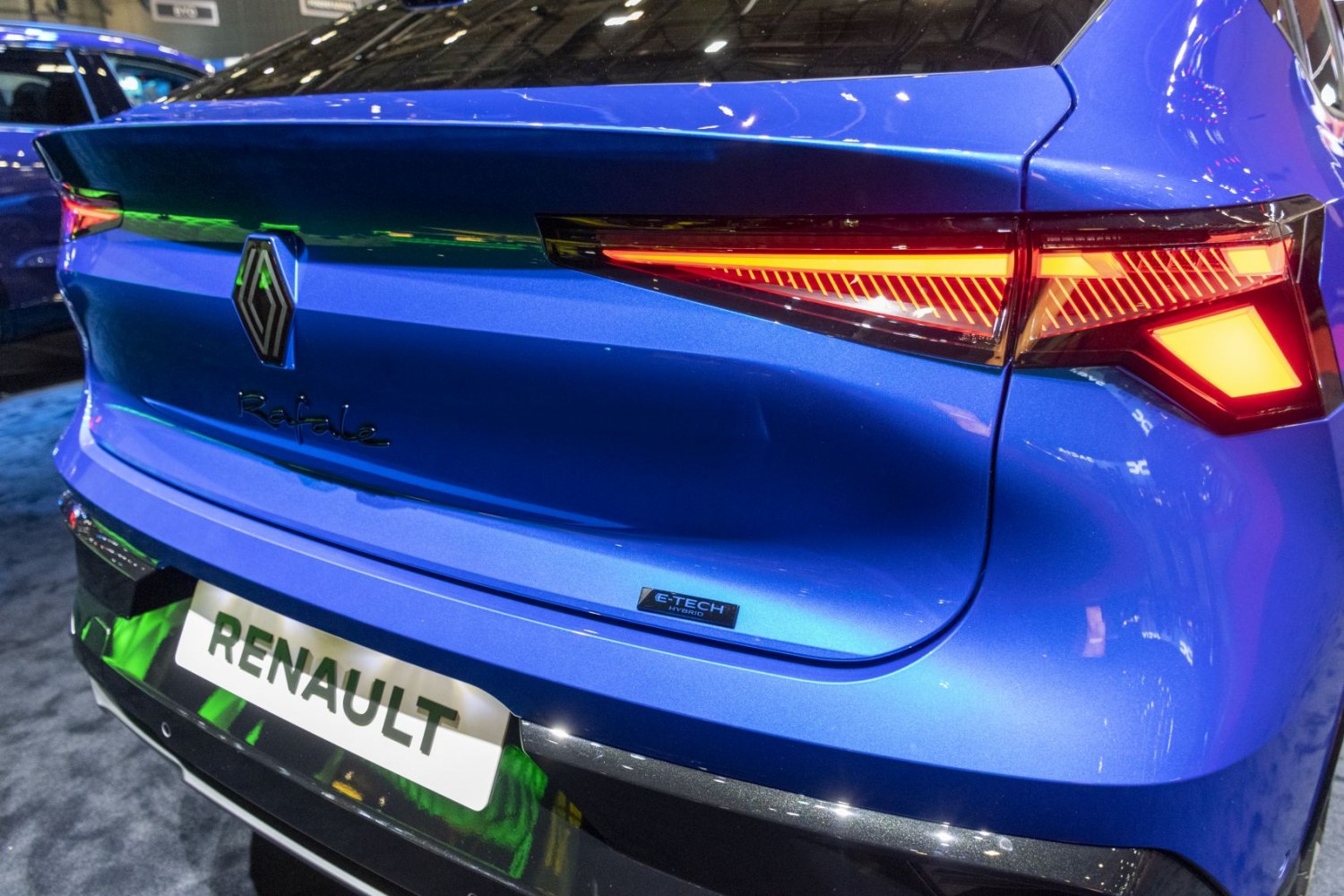 Sleek rear tail light and E-TECH hybrid badge of a modern hatchback