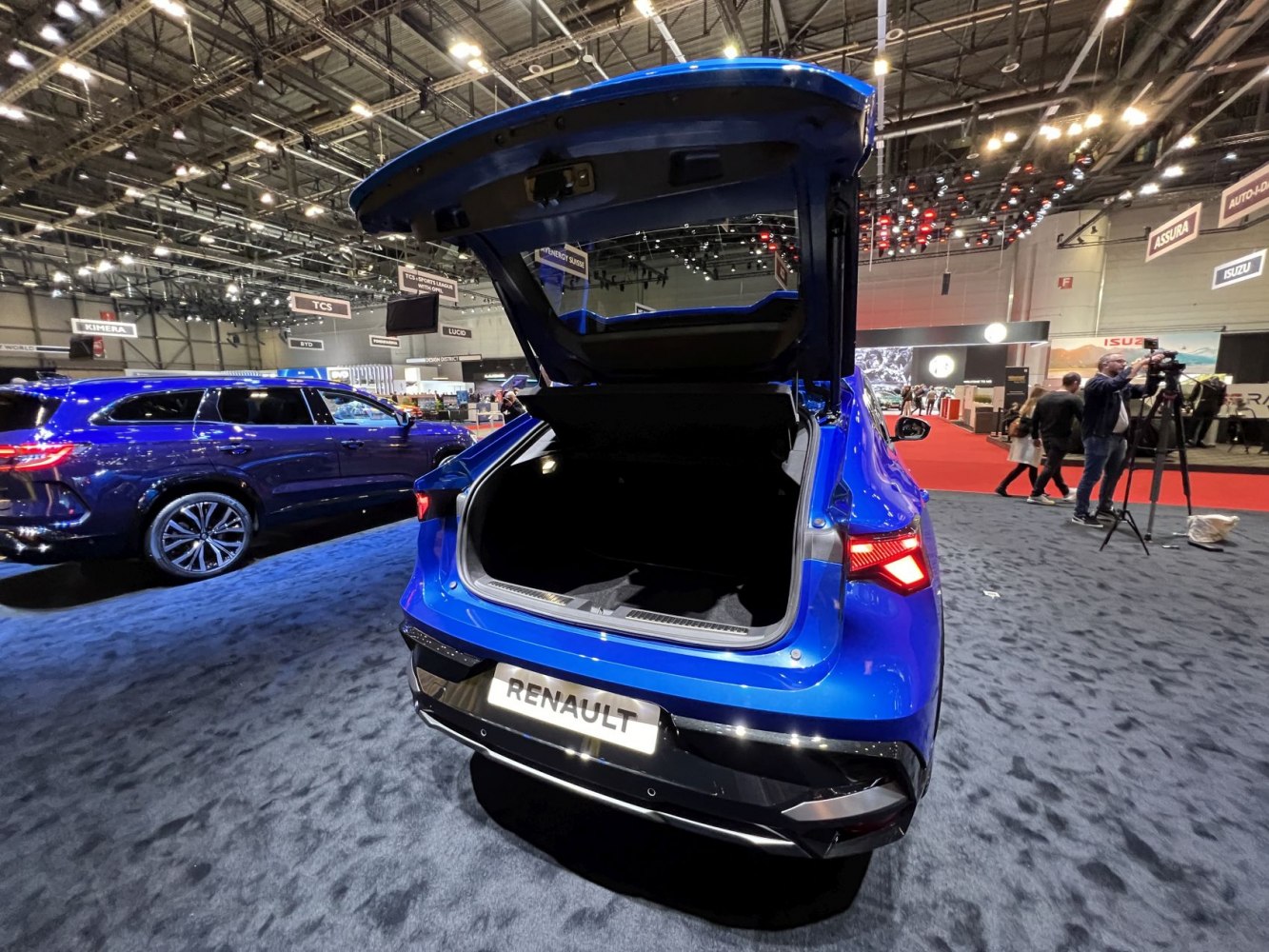 Open trunk and rear view of a modern SUV with illuminated rear lights