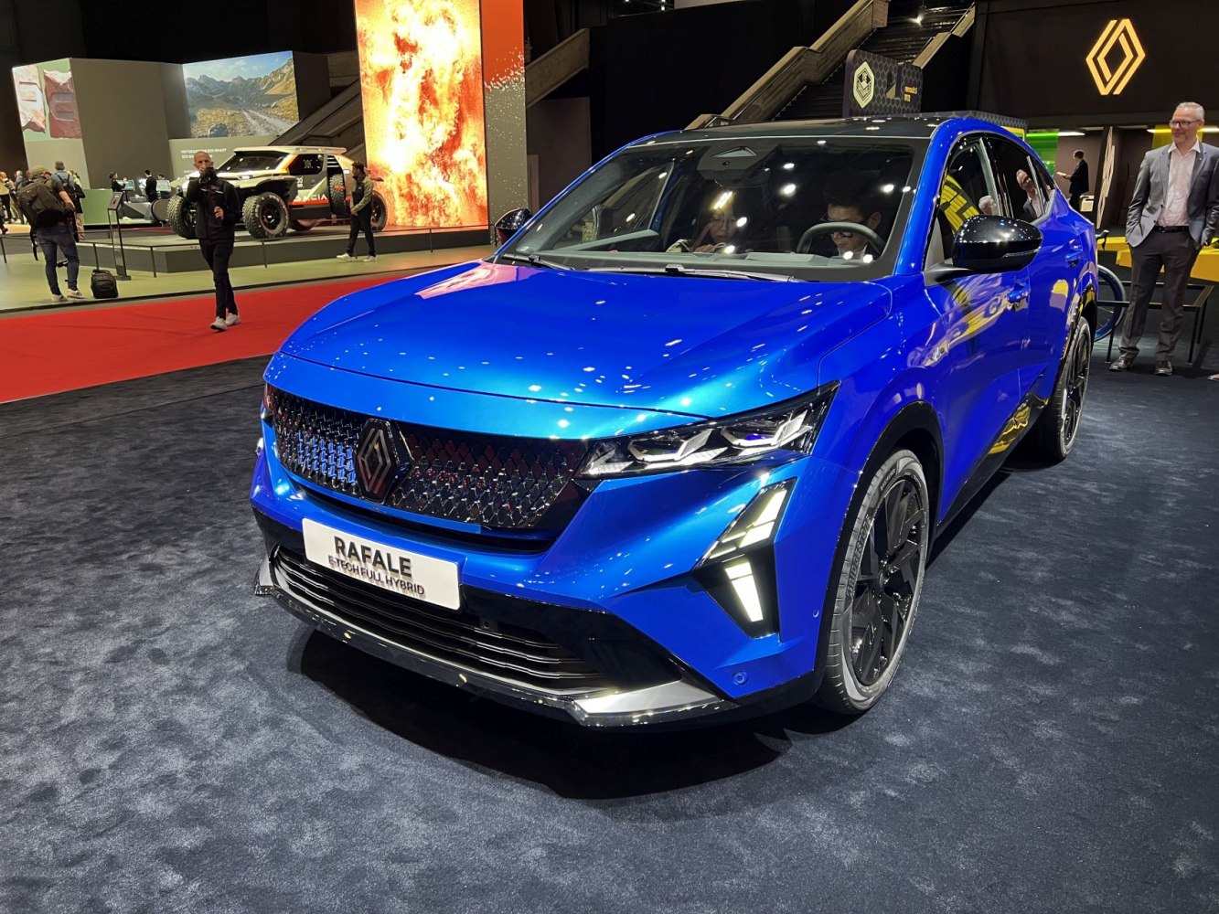 Electric blue compact SUV with LED headlights and distinctive front grille