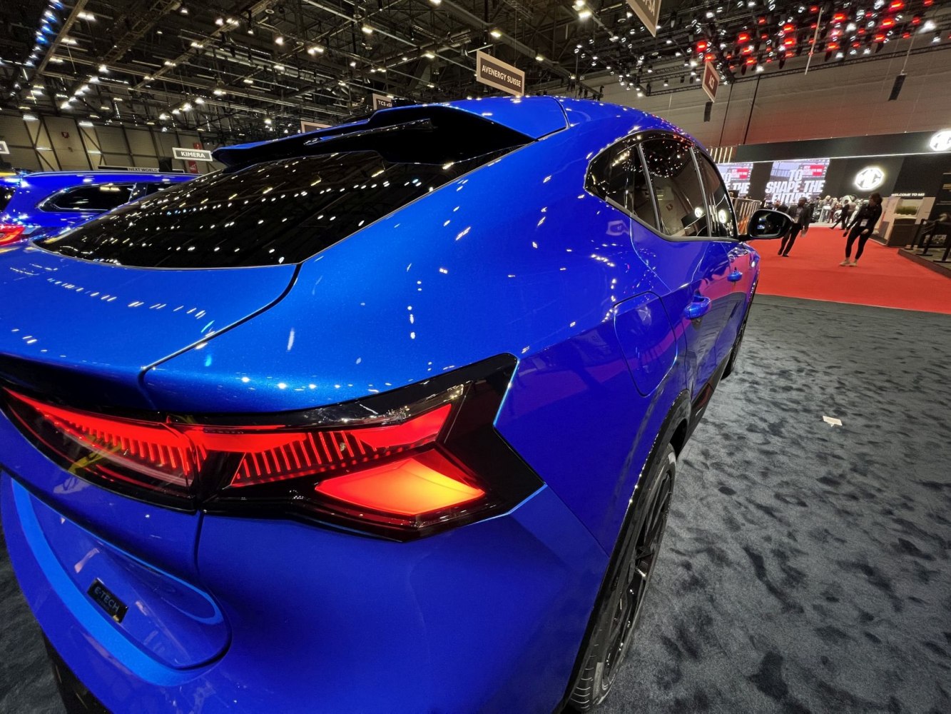 Modern LED taillights and streamlined rear design in vibrant blue finish