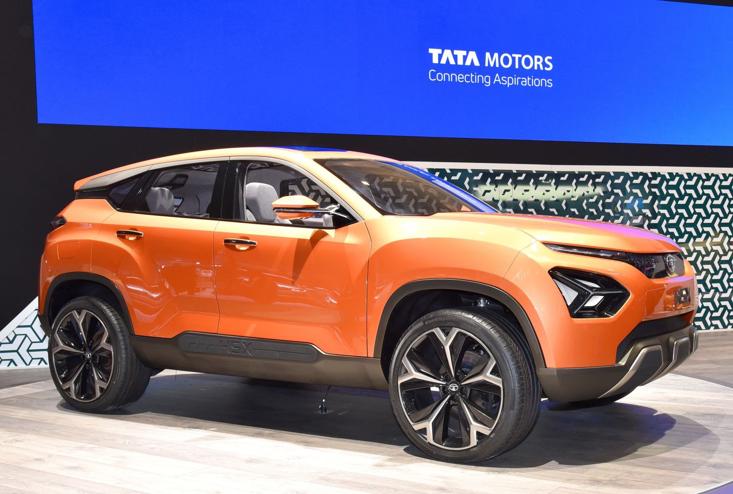 High-angle side view of a futuristic SUV with sculpted body and large alloy wheels