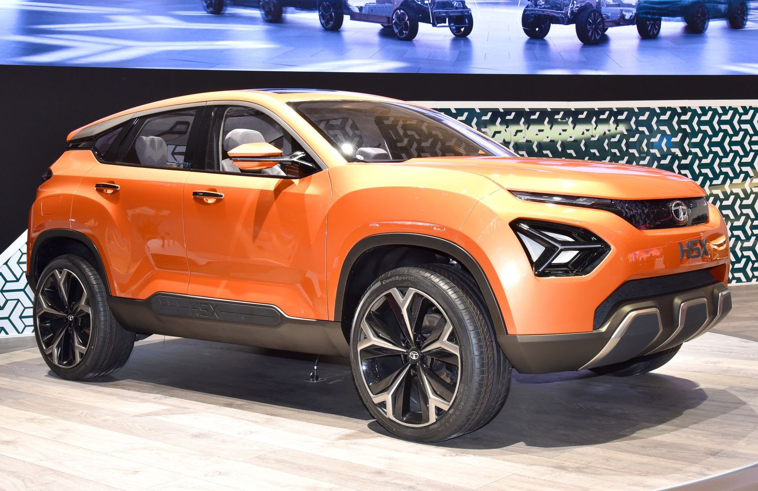 Orange SUV with futuristic LED front lights and bold body lines
