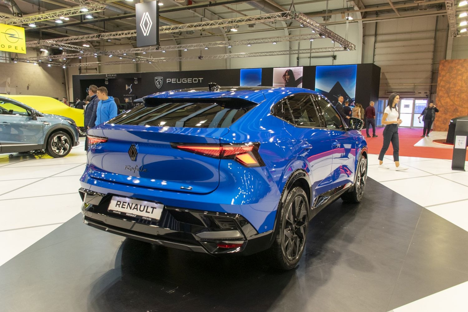 Sleek rear view of a modern electric crossover SUV with distinctive taillights.