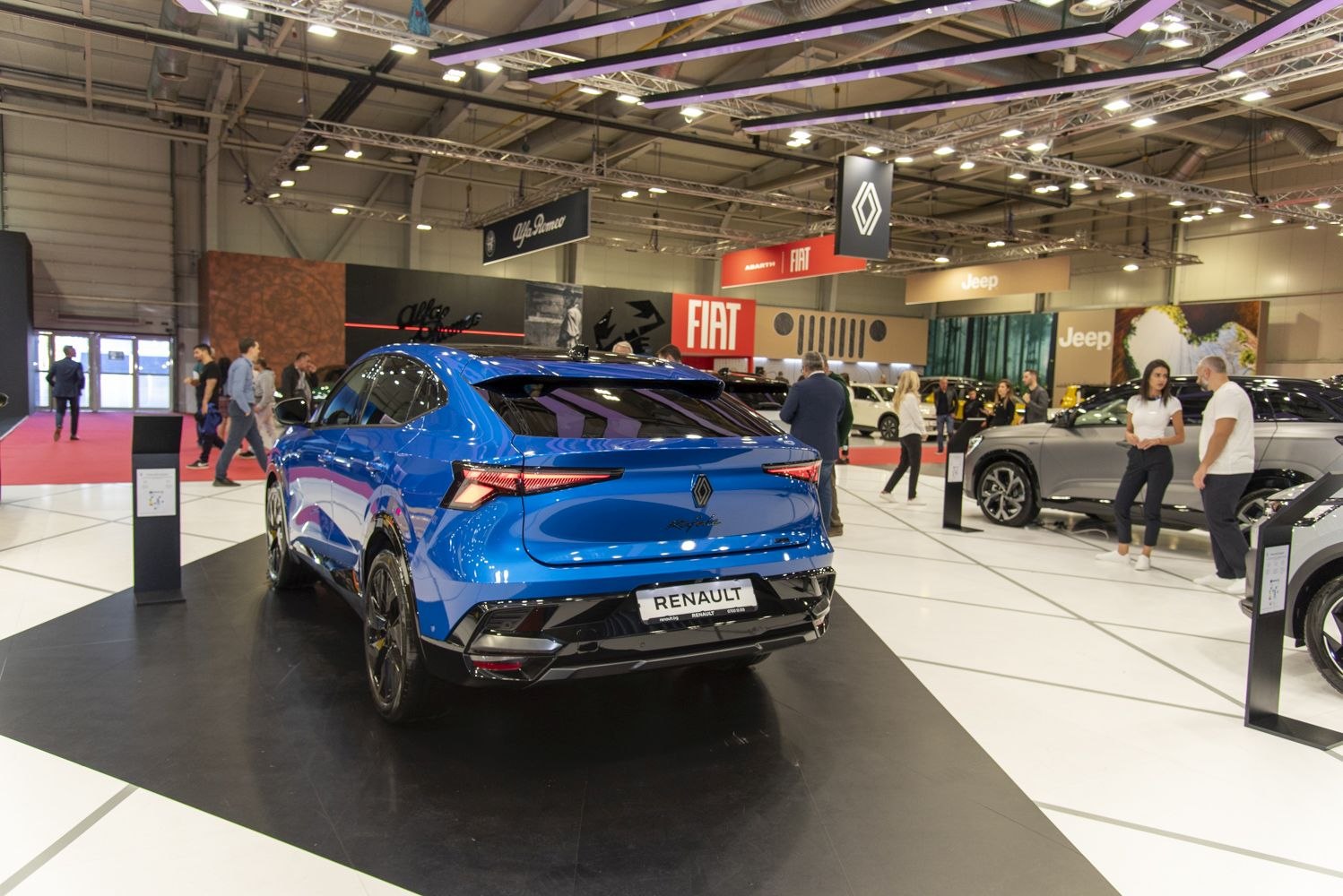 Rear view of a sleek blue SUV with LED tail lights.