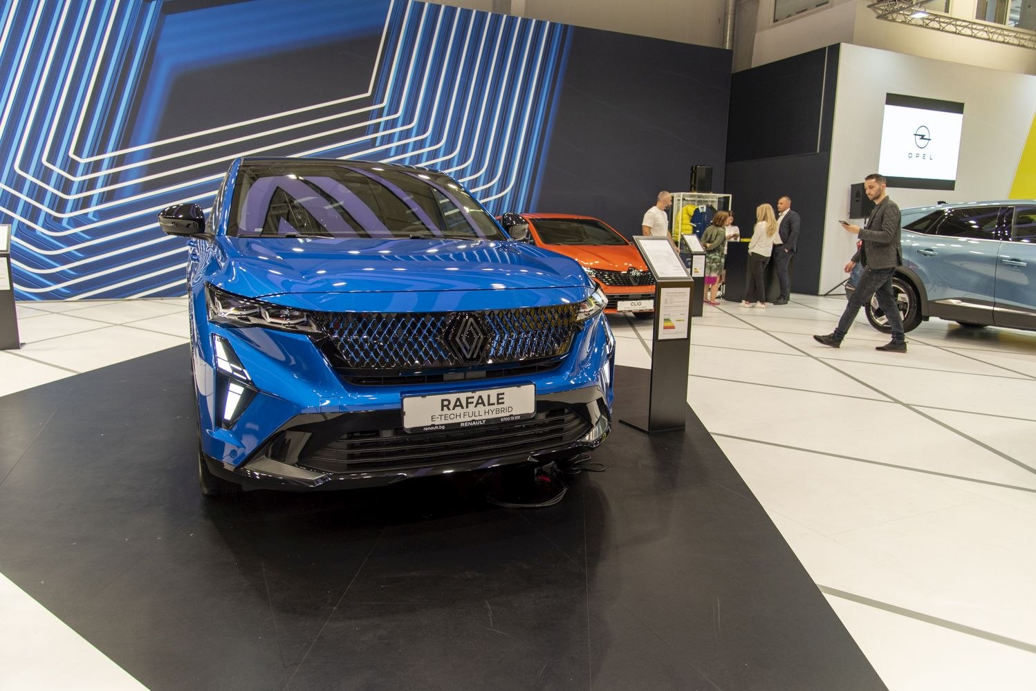 Front view of a sleek modern hybrid SUV with distinctive grille and LED headlights