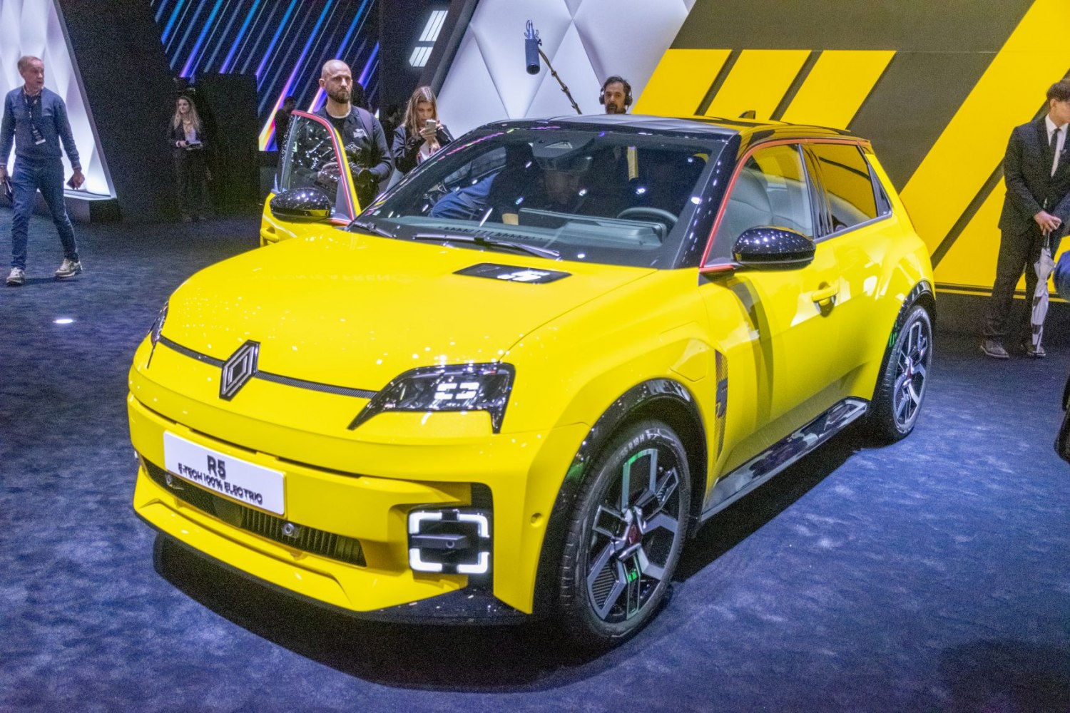 Yellow electric hatchback with LED headlights and two-tone roof