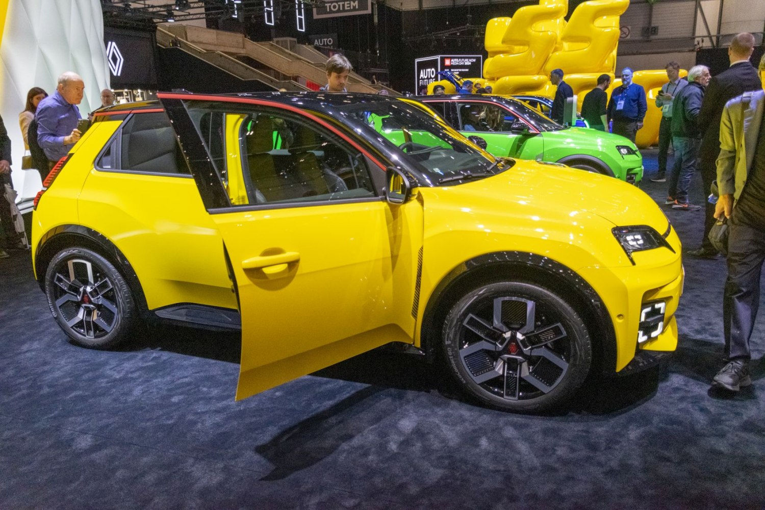Yellow electric hatchback with distinctive modern design and open door