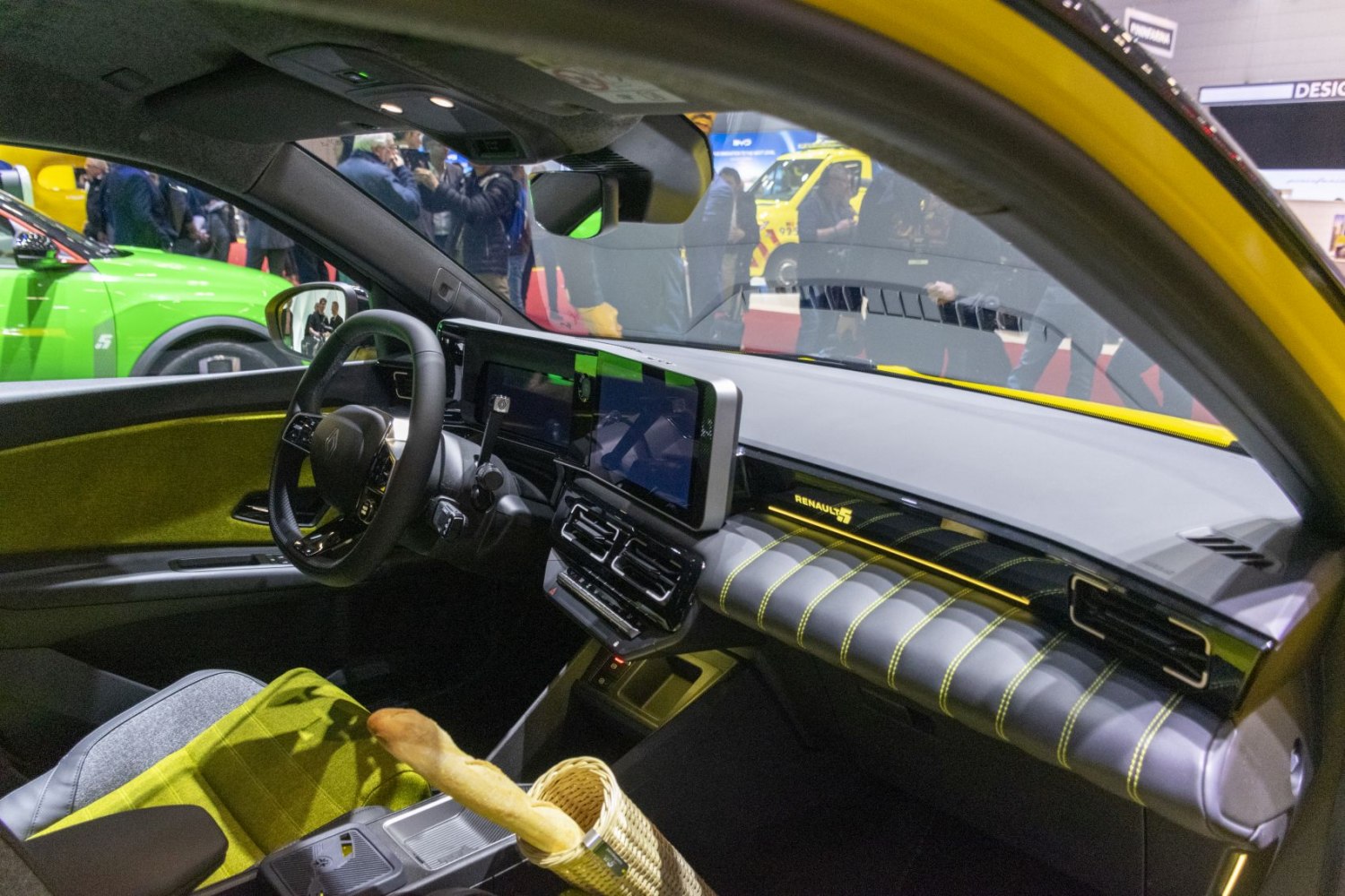 Modern dashboard and steering wheel with digital displays and stylish upholstery