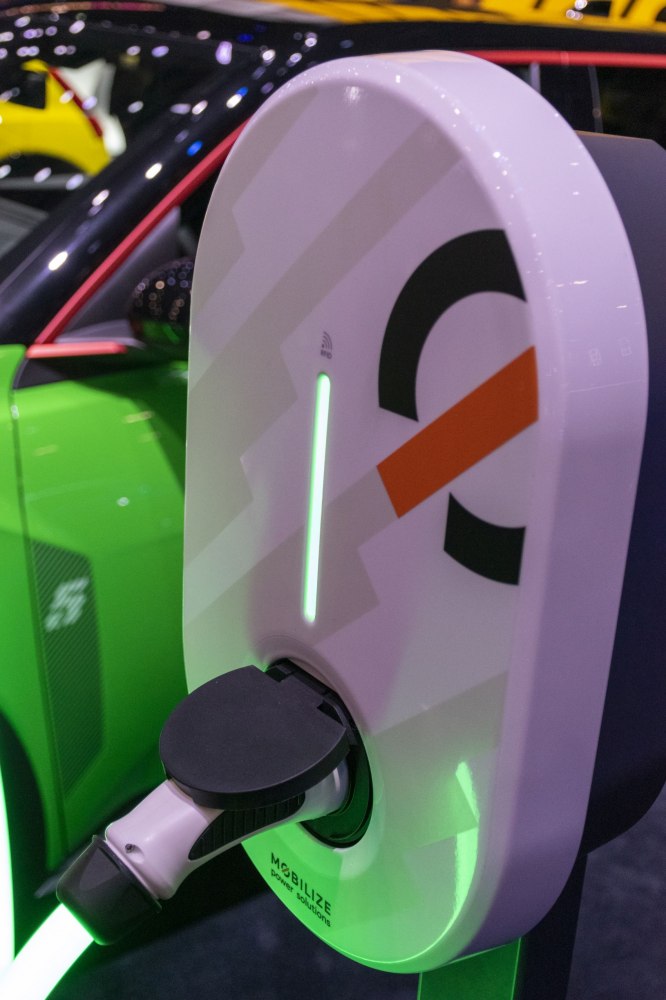 Close-up of electric vehicle charging port and cable.