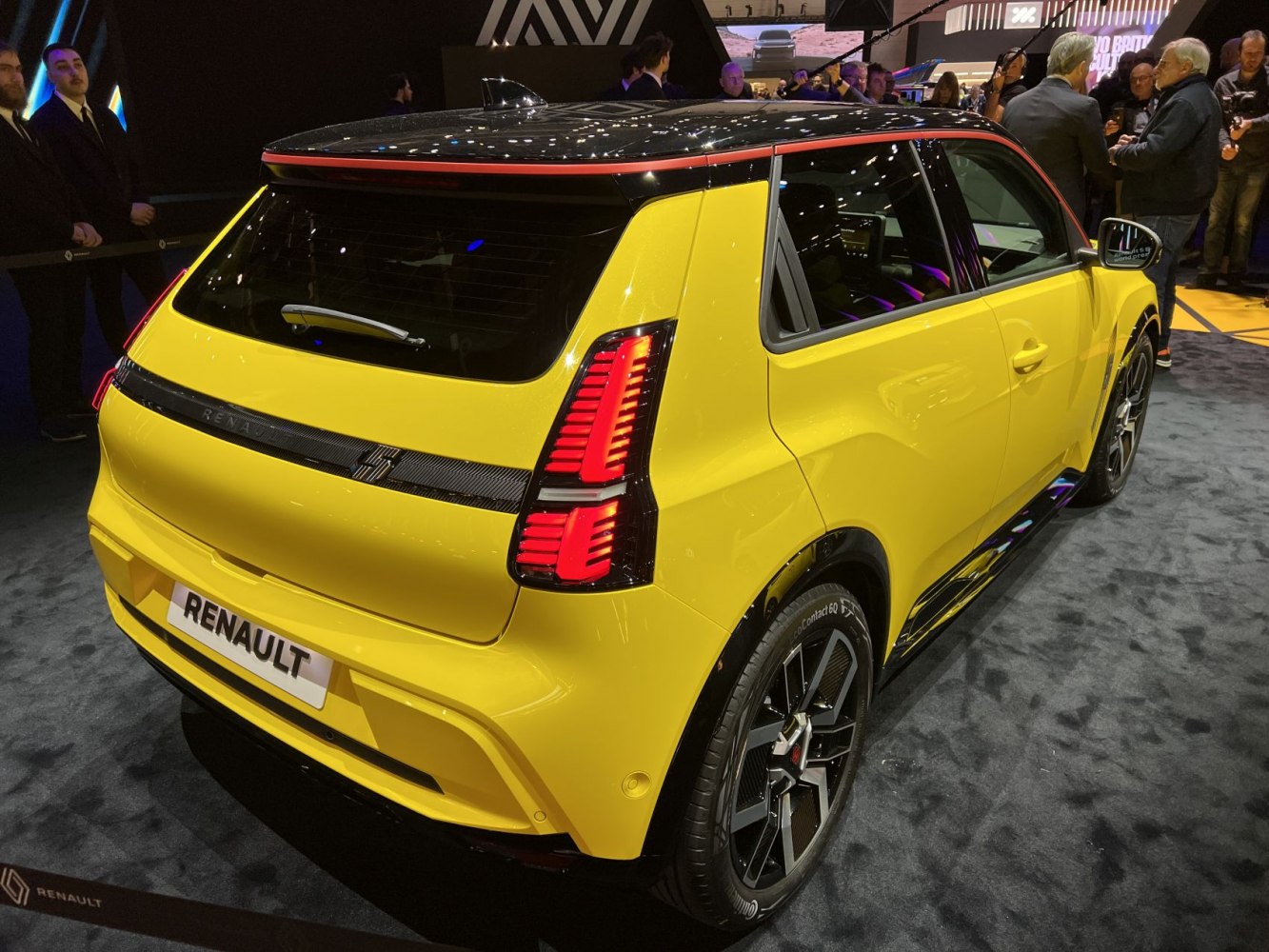 Rear and side view with bold tail lights and sporty rear styling.