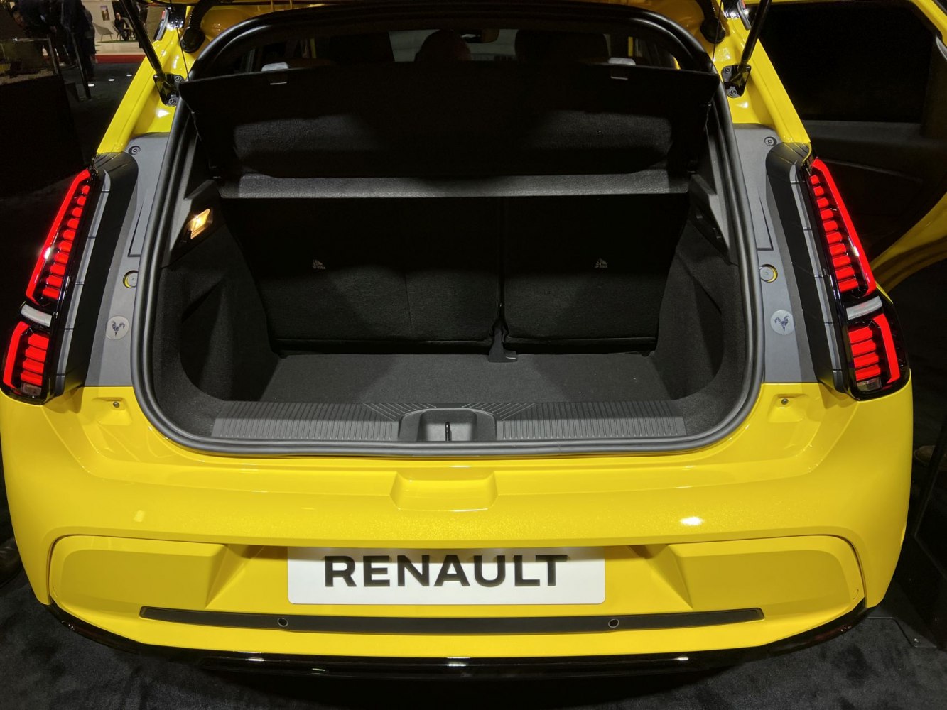 Open rear trunk with spacious cargo area in a hatchback.