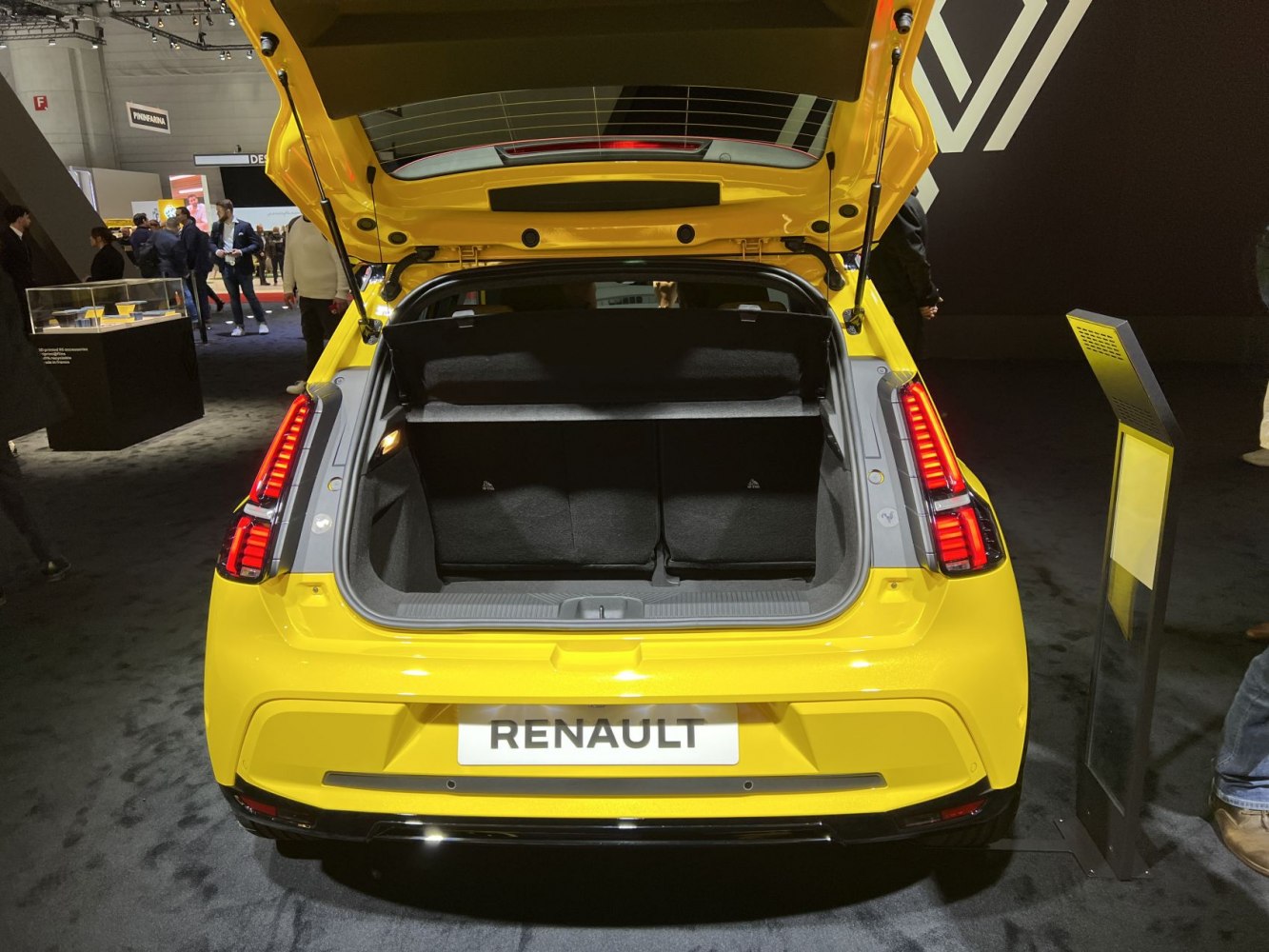 Rear view hatchback with open trunk and red vertical taillights