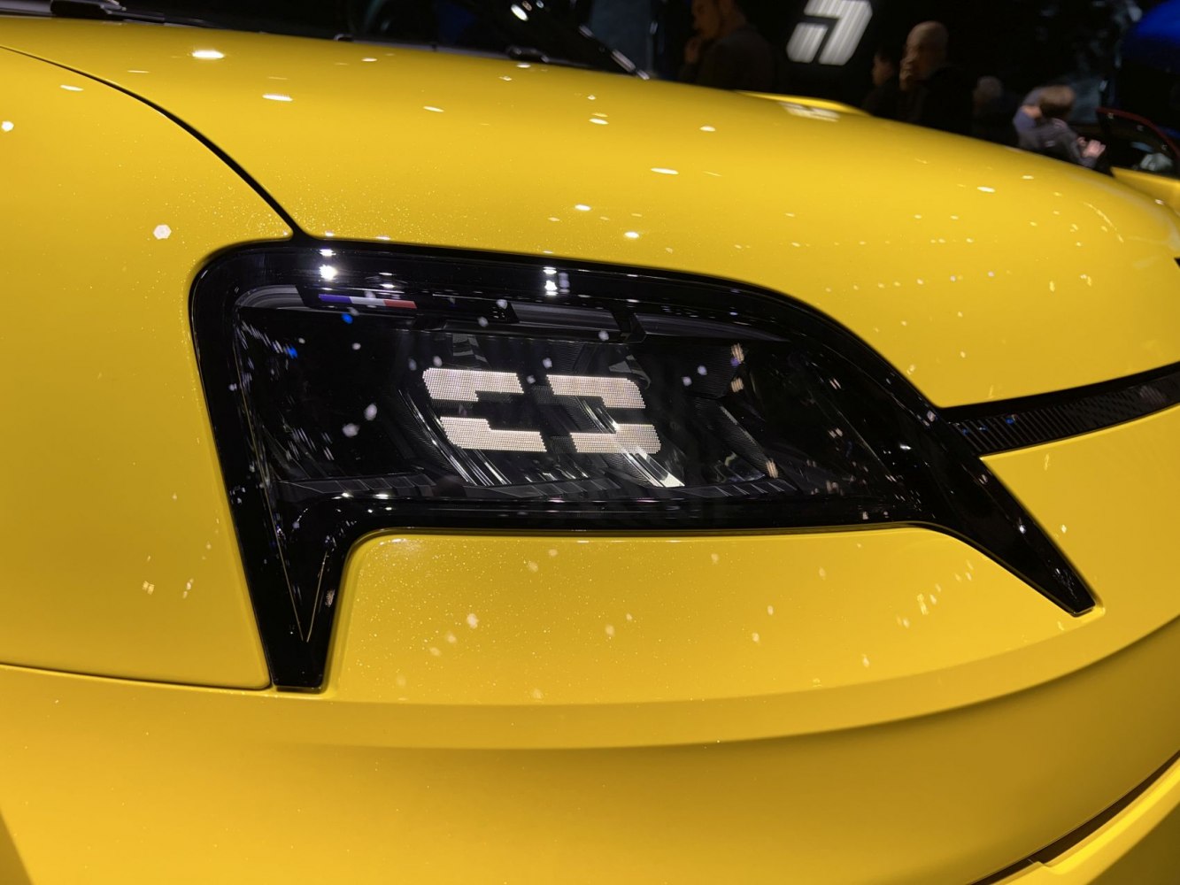 Close-up of futuristic LED headlight with distinctive rectangular pattern