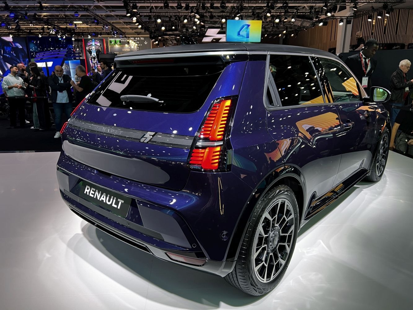 Futuristic vertical LED taillights and modern wheel design with side profile.