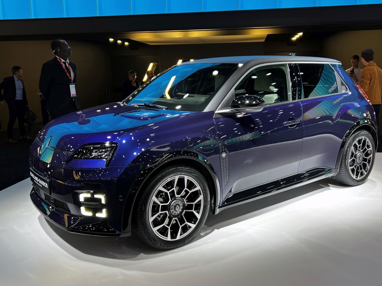 Futuristic LED headlights and alloy wheels on a modern hatchback side profile.
